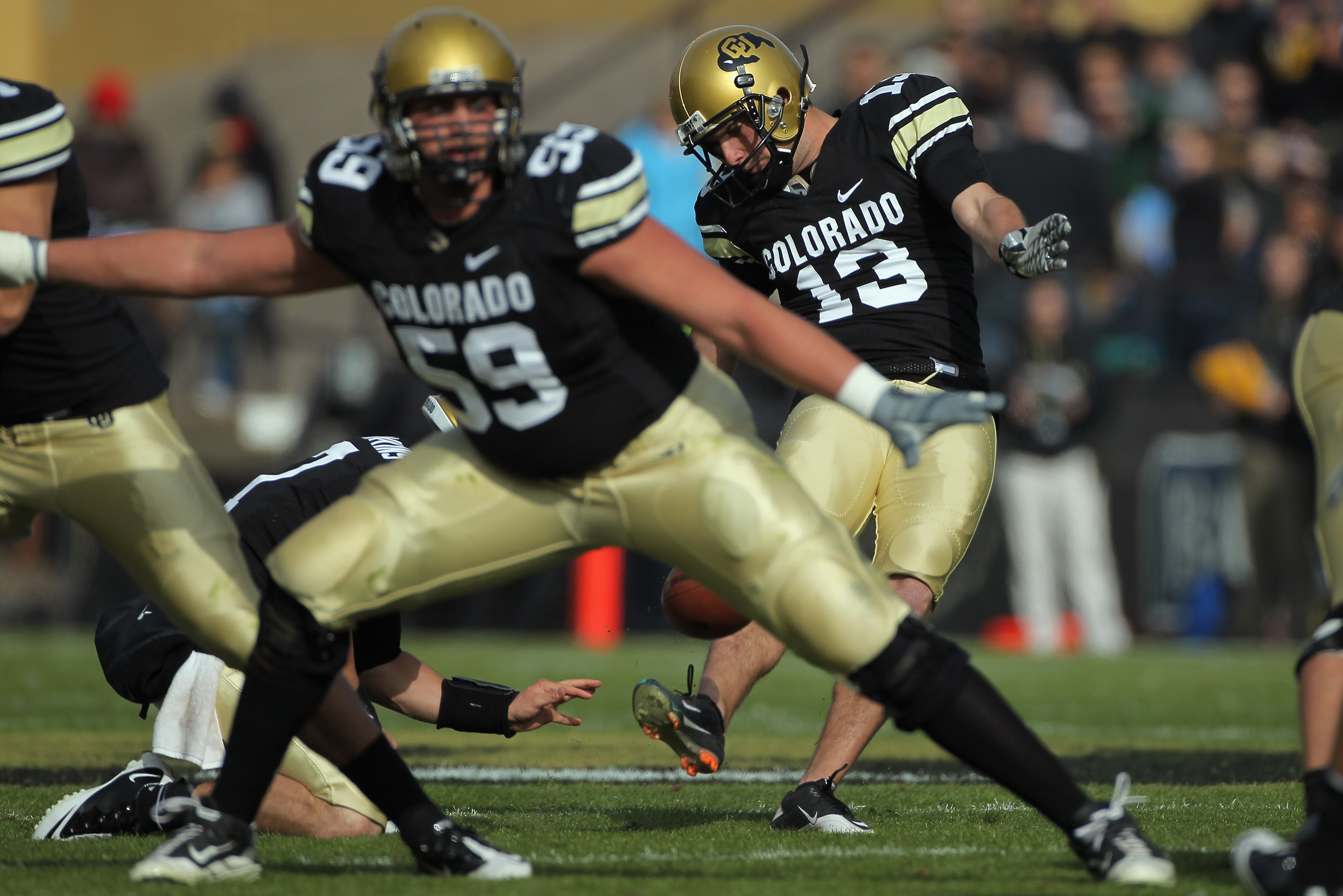 BOULDER, CO - NOVEMBER 20:  Place kicker Aric Goodman #13 of the Colorado Buffaloes kicks a field goal against the Kansas State Wildcats at Folsom Field on November 20, 2010 in Boulder, Colorado.  (Photo by Doug Pensinger/Getty Images)