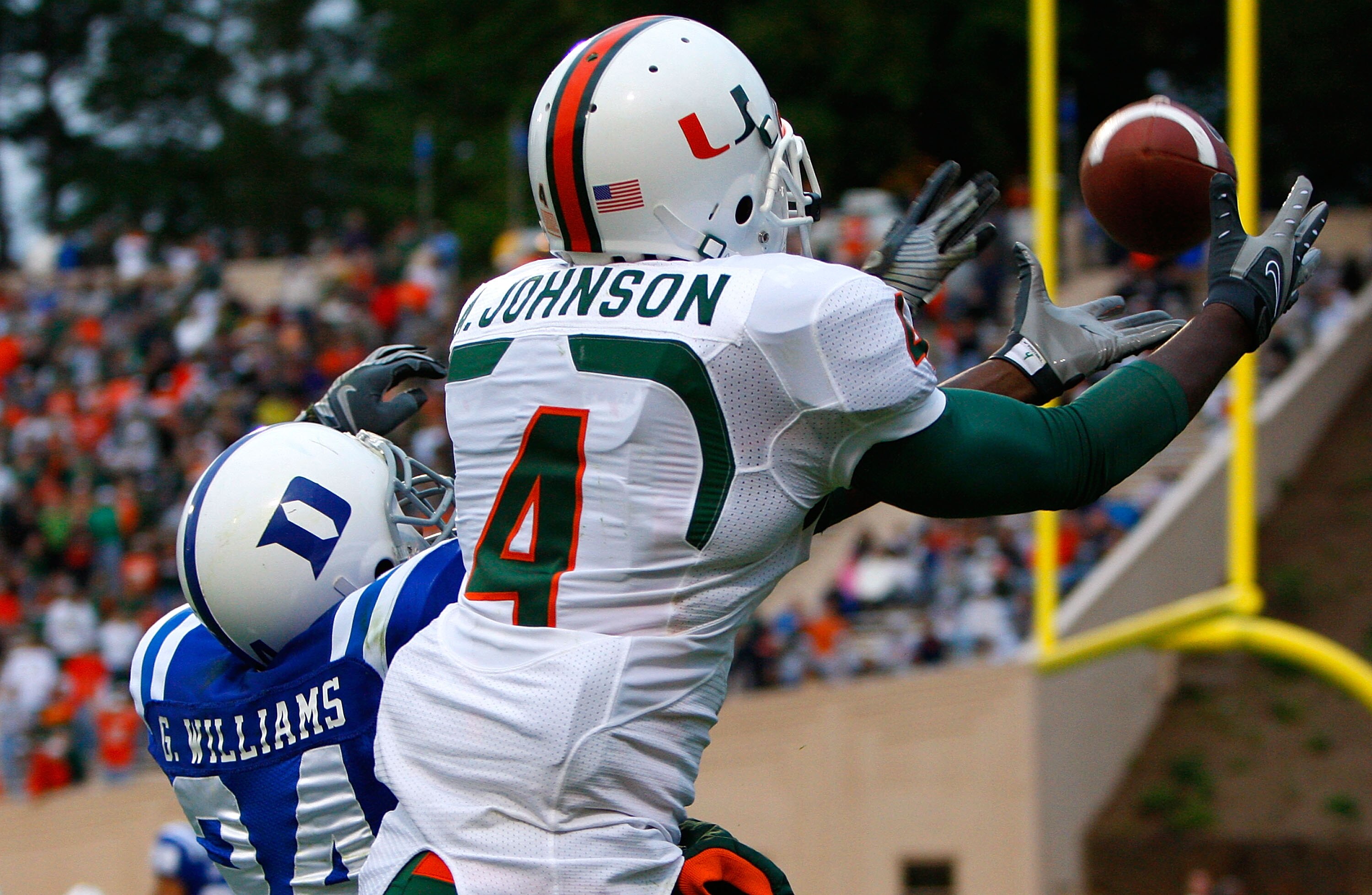 DURHAM, NC - OCTOBER 18:  Receiver Aldarius Johnson #4 of the Miami Hurricanes pulls in this touchdown reception against Glenn Williams #24 of the Duke Blue Devils during the game at Wallace Wade Stadium on October 18, 2008 in Durham, North Carolina.  (Ph