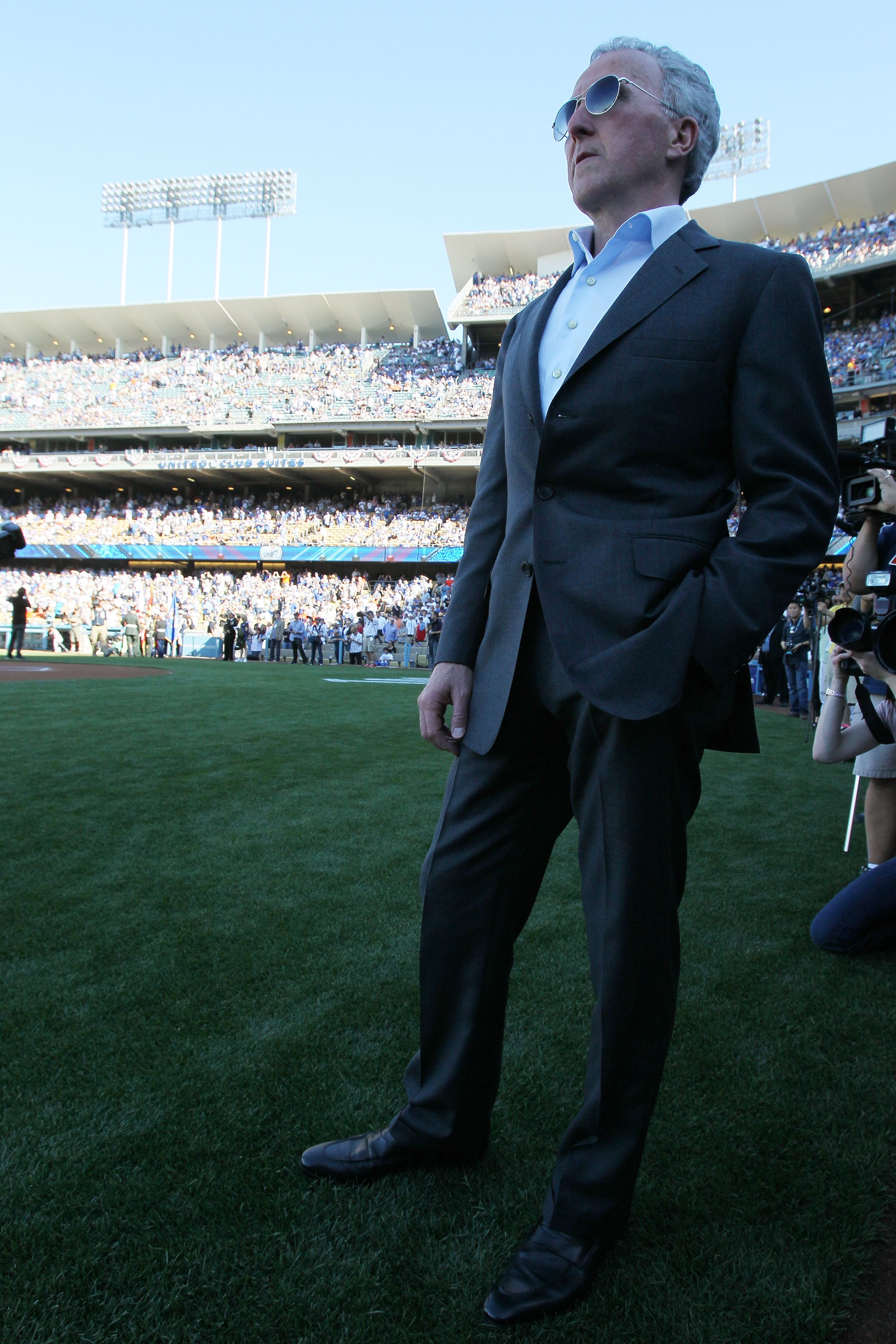 LOS ANGELES, CA - MARCH 31:  Los Angeles Dodgers owner Frank McCourt stands on the field prior to their Opening Day game against the San Francisco Giants at Dodger Stadium on March 31, 2011 in Los Angeles, California.  (Photo by Jeff Gross/Getty Images)