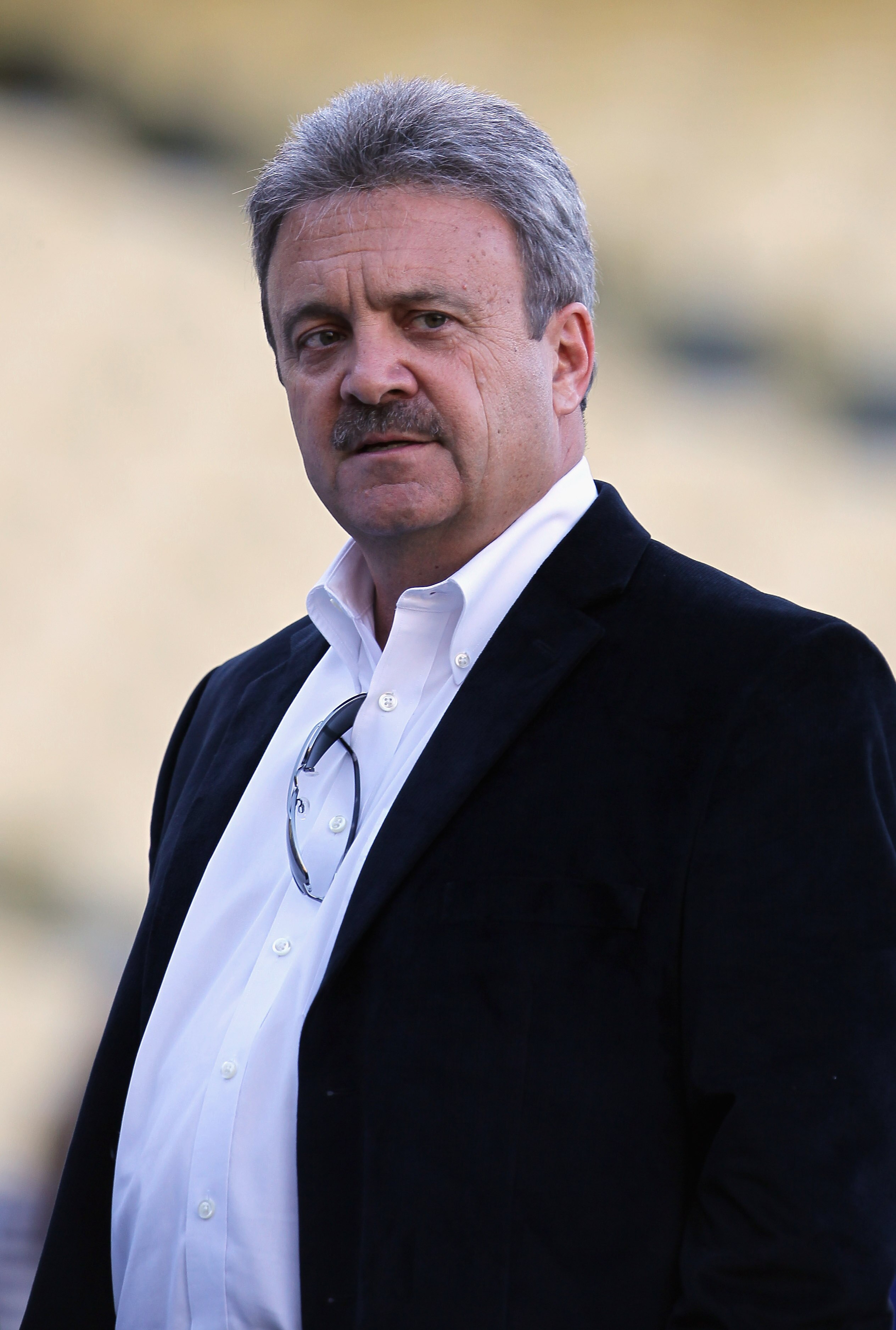 LOS ANGELES, CA - APRIL 01:  Los Angeles Dodgers general manager Ned Colletti looks on prior to the start of the game against the San Francisco Giants at Dodger Stadium on April 1, 2011 in Los Angeles, California.  (Photo by Jeff Gross/Getty Images)