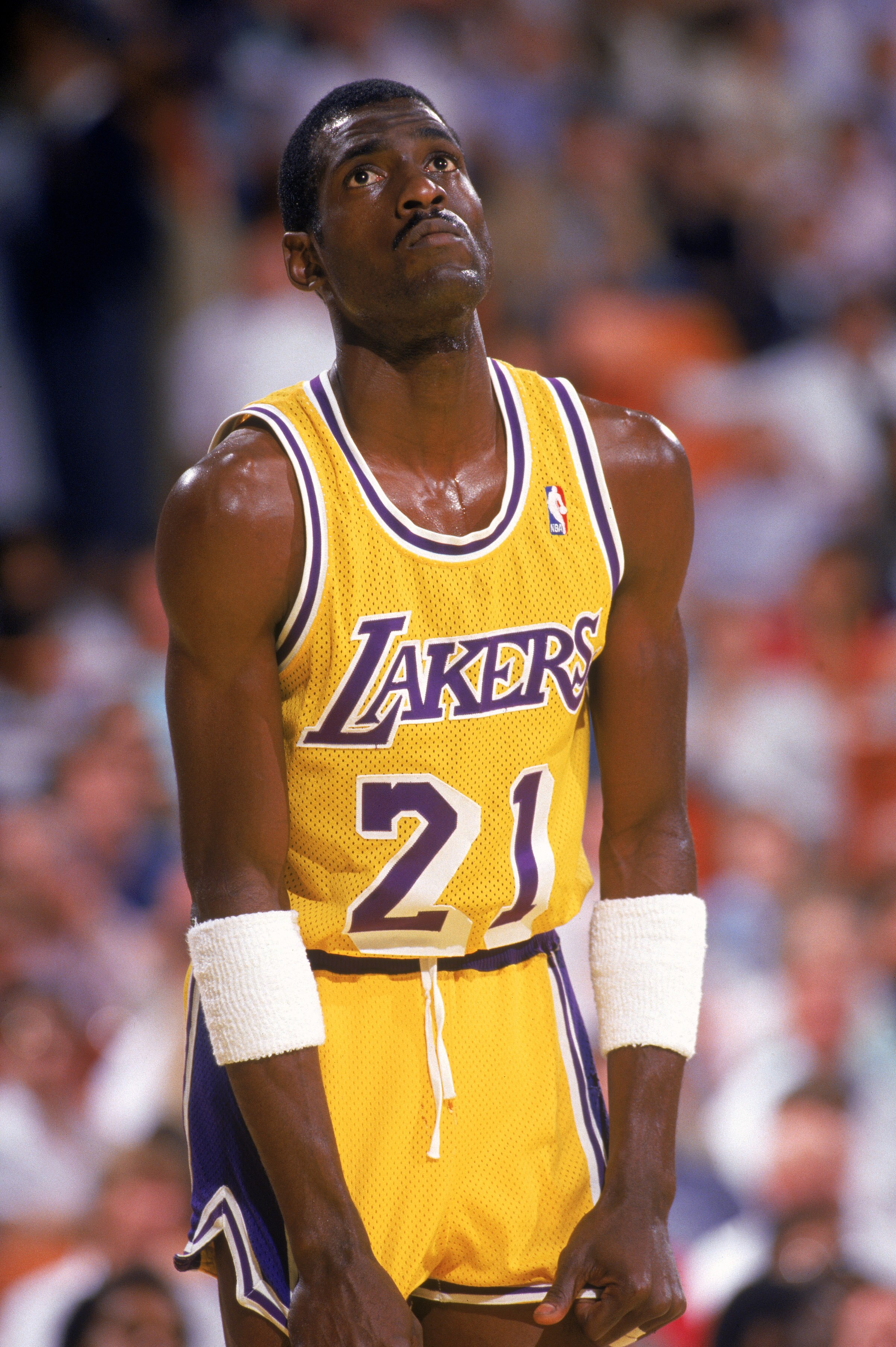 LOS ANGELES - 1987:  Michael Cooper #21 of the Los Angeles Lakers stands on the court during an NBA game at the Great Western Forum in Los Angeles, California in 1987. (Photo by: Scott Halleran/Getty Images)