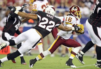 GLENDALE, AZ - SEPTEMBER 02:  Wide receiver Brandon Banks #16 of the Washington Redskins runs with the ball after a reception past Matt Ware #22 of the Arizona Cardinals during preseason NFL game at the University of Phoenix Stadium on September 2, 2010 i