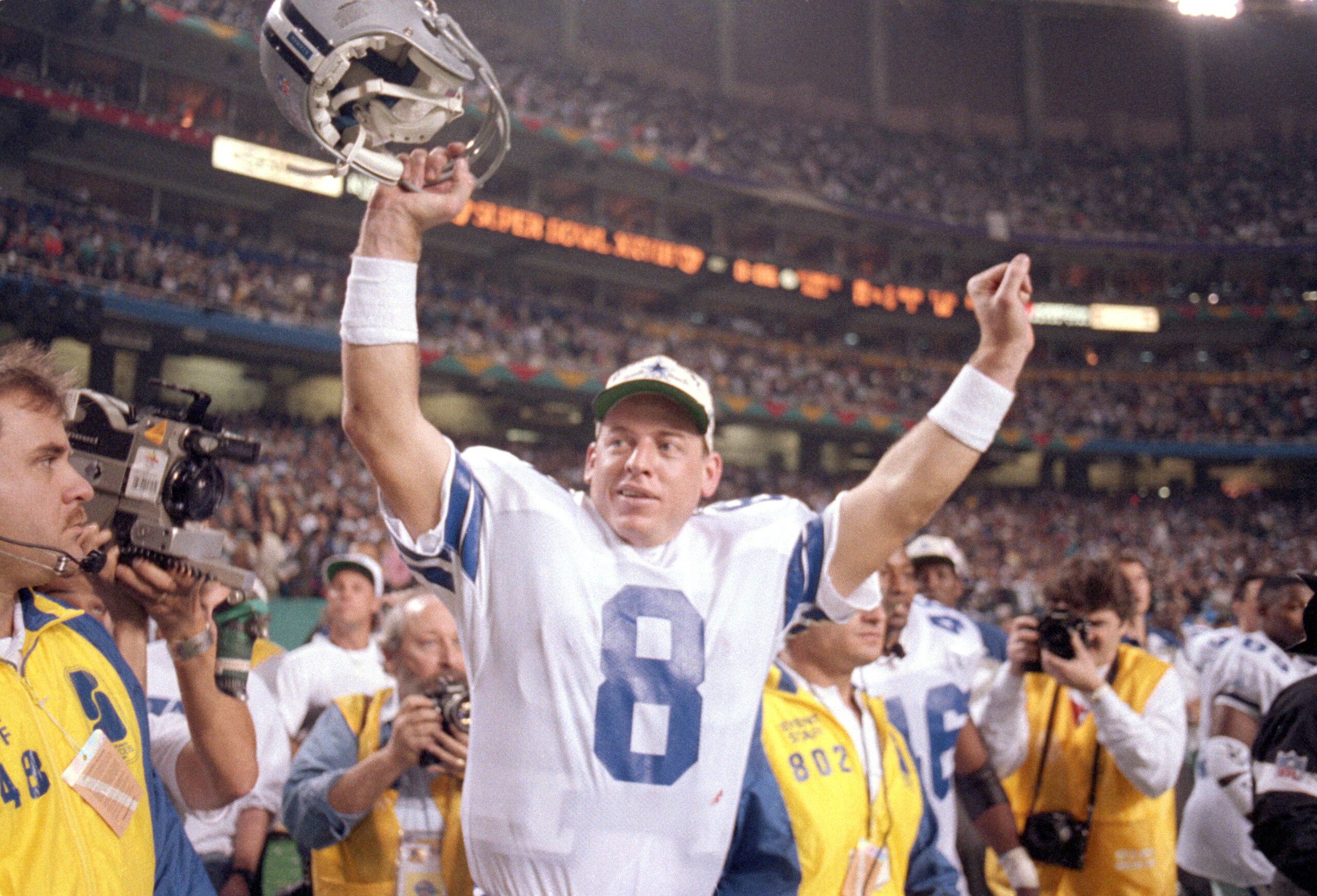 ATLANTA - JANUARY 30:  Quarterback Troy Aikman #8 of the Dallas Cowboys celebrates their victory over the Buffalo Bills in Super Bowl XXVIII at the Georgia Dome on January 30, 1994 in Atlanta, Georgia.  The Cowboys won 30-13.  (Photo by George Rose/Getty