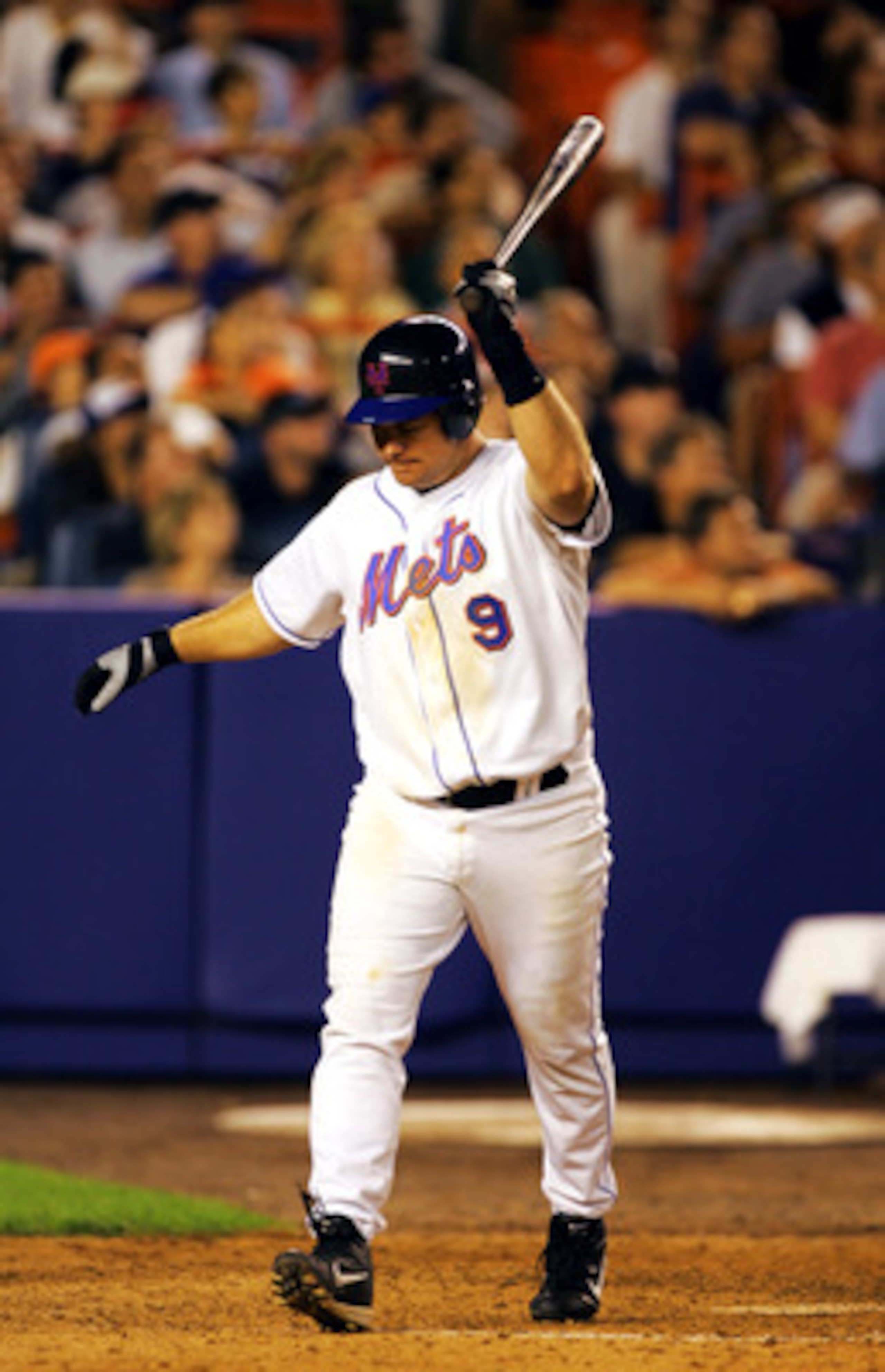 NEW YORK - JULY 15:  Ty Wigginton #9 of the New York Mets upset after making the last out of the ninth inning with two runners on base against the Philidelphia Phillies on July 15, 2004, at Shea Stadium in Flushing, New York.   (Photo by Ezra Shaw/Getty I