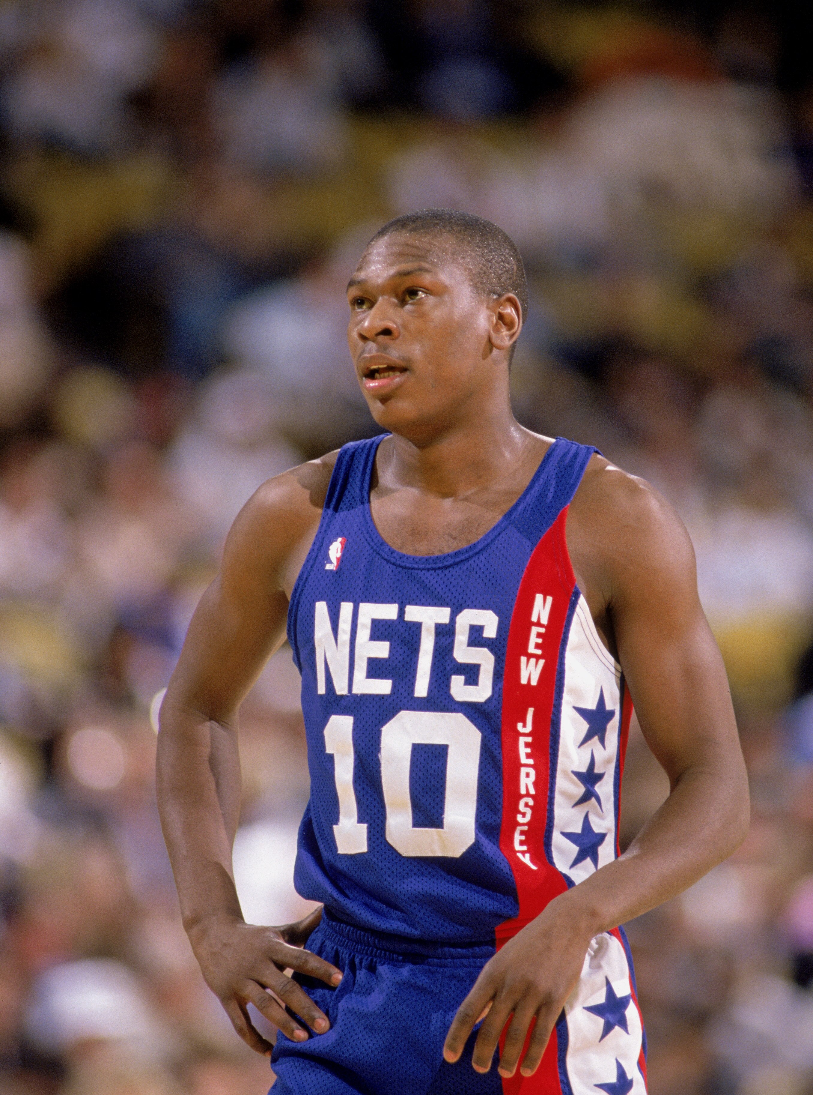 1990:  Mookie Blaylock #10 of the New Jersey Nets stands on the court during an NBA game in 1990. NOTE TO USER: User expressly acknowledges and agrees that, by downloading and/or using this Photograph, User is consenting to the terms and conditions of the