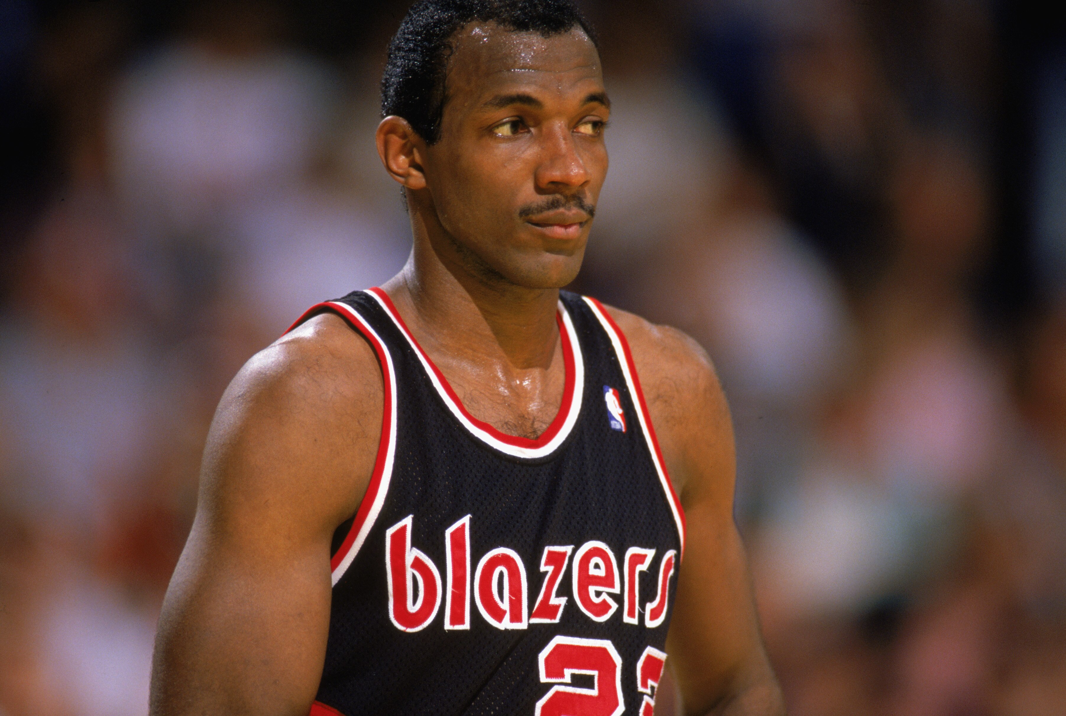 1987:  Clyde Drexler #22 of the Portland Trail Blazers watches the 1987-1988 NBA season game.  (Photo by Mike Powell/Getty Images)