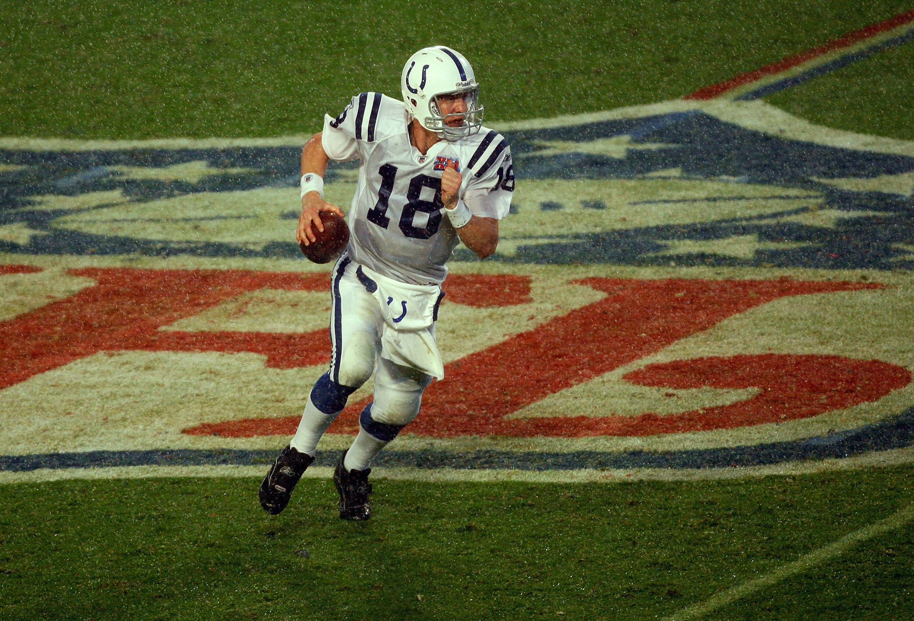 MIAMI GARDENS, FL - FEBRUARY 04:  Quarterback Peyton Manning #18 of the Indianapolis Colts rolls out to pass against the Chicago Bears during Super Bowl XLI on February 4, 2007 at Dolphin Stadium in Miami Gardens, Florida. The Colts won 29-17. (Photo by E