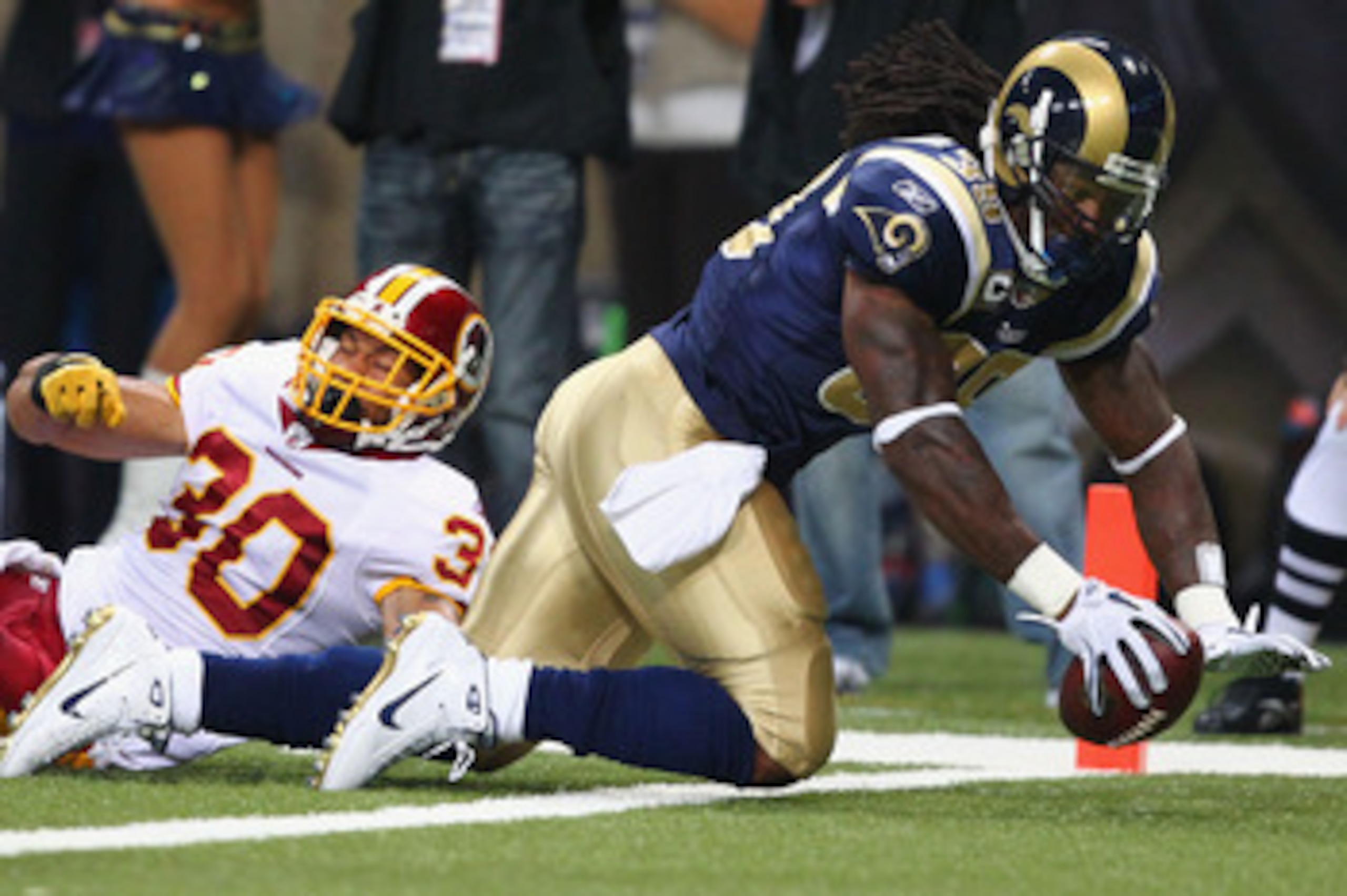 ST. LOUIS - SEPTEMBER 26: Steven Jackson #39 of the St. Louis Rams scores a touchdown against LaRon Landry #30 of the Washington Redskins at the Edward Jones Dome on September 26, 2010 in St. Louis, Missouri.  The Rams beat the Redskins 30-16.  (Photo by
