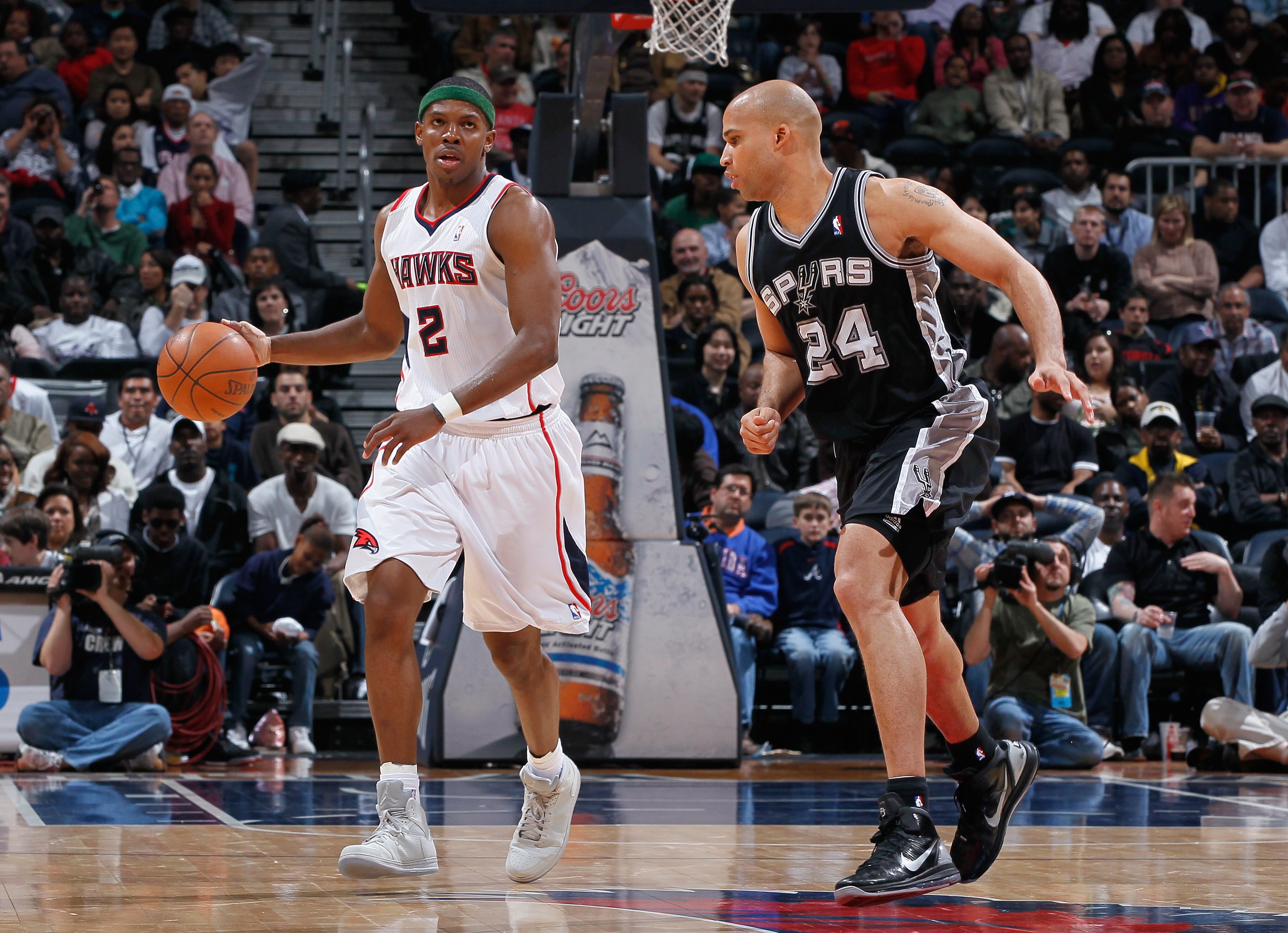 ATLANTA, GA - APRIL 05:  Joe Johnson #2 of the Atlanta Hawks against Richard Jefferson #24 of the San Antonio Spurs at Philips Arena on April 5, 2011 in Atlanta, Georgia.  NOTE TO USER: User expressly acknowledges and agrees that, by downloading and/or us