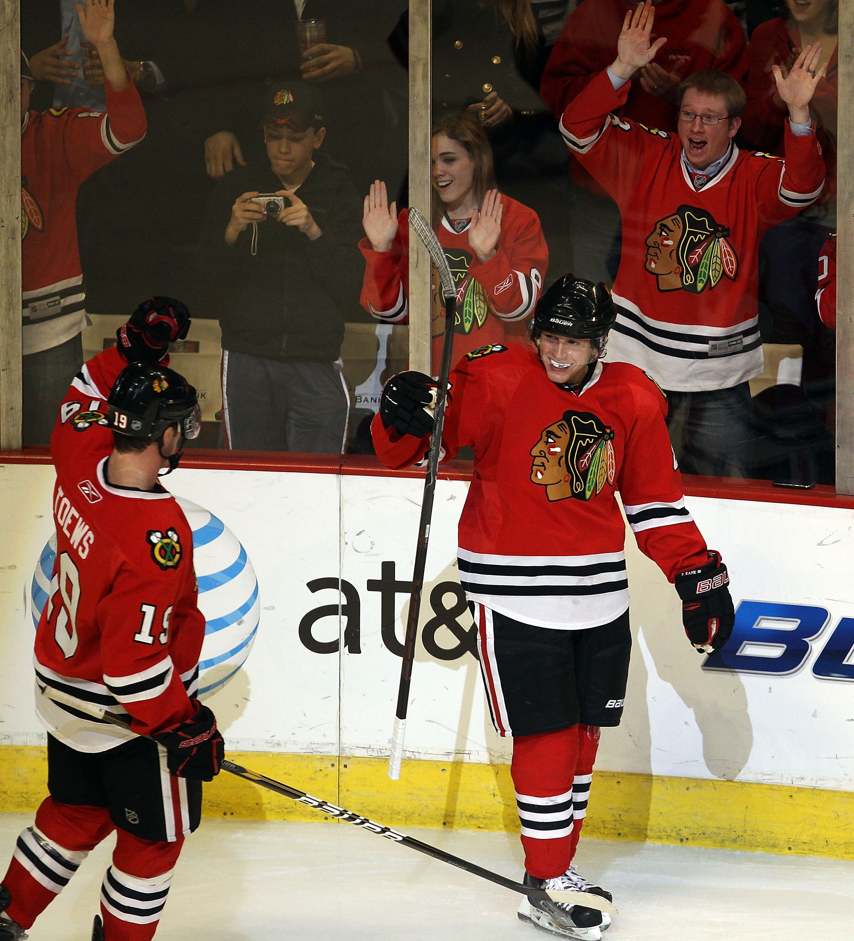 CHICAGO, IL - MARCH 23: Jonathan Toews #19 and Patrick Kane #88 of the Chicago Blackhawks celebrate Kane's 3rd period goal against the Florida Panthers at the United Center on March 23, 2011 in Chicago, Illinois. The Blackhawks defeated the Panthers 4-0.
