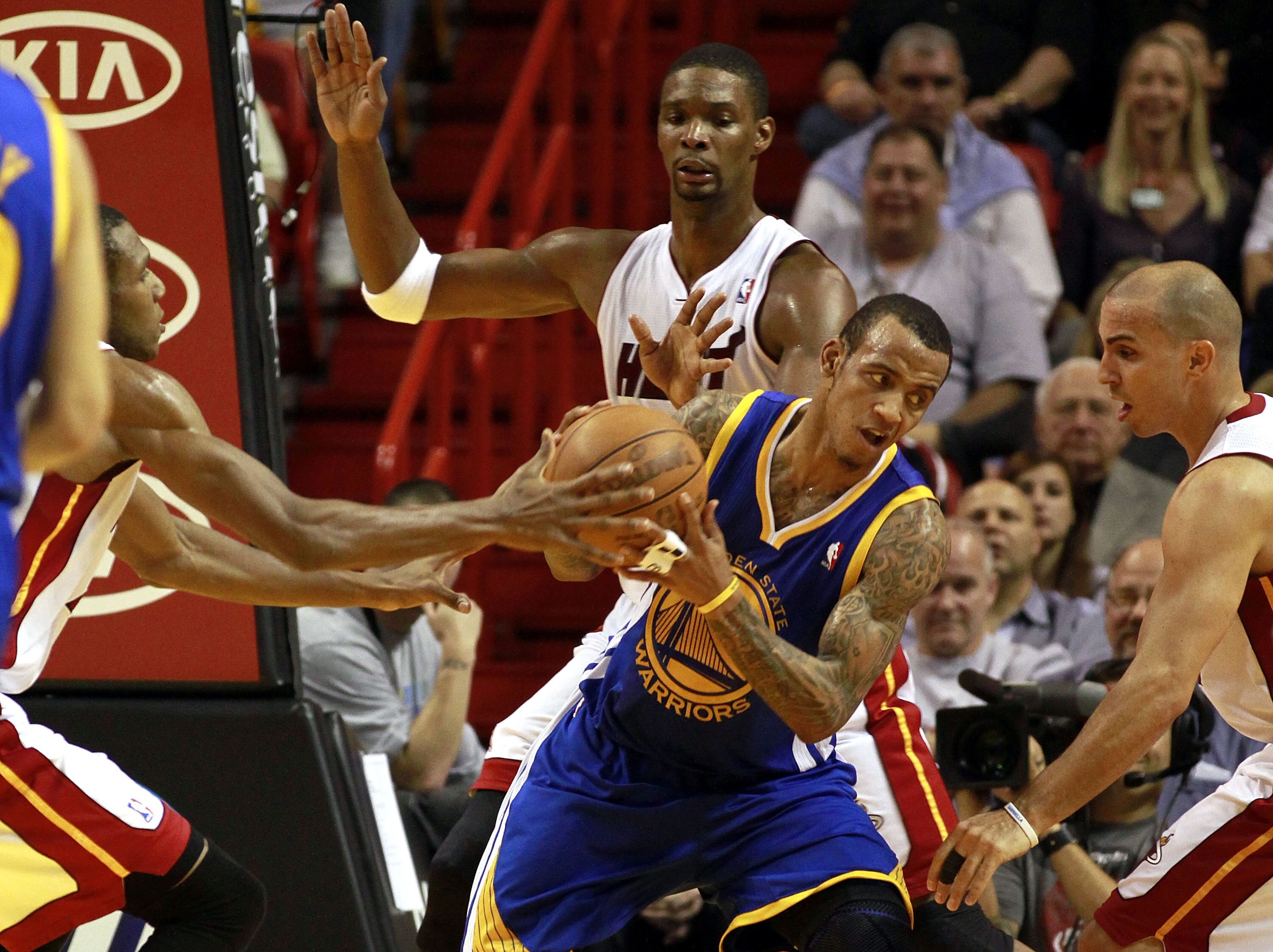 MIAMI - JANUARY 01:  Monta Ellis # 8 of the Golden State Warriors protects the ball  during a game against the Miami Heat at American Airlines Arena on January 1, 2011 in Miami, Florida. The Heat won 114-107. NOTE TO USER: User expressly acknowledges and