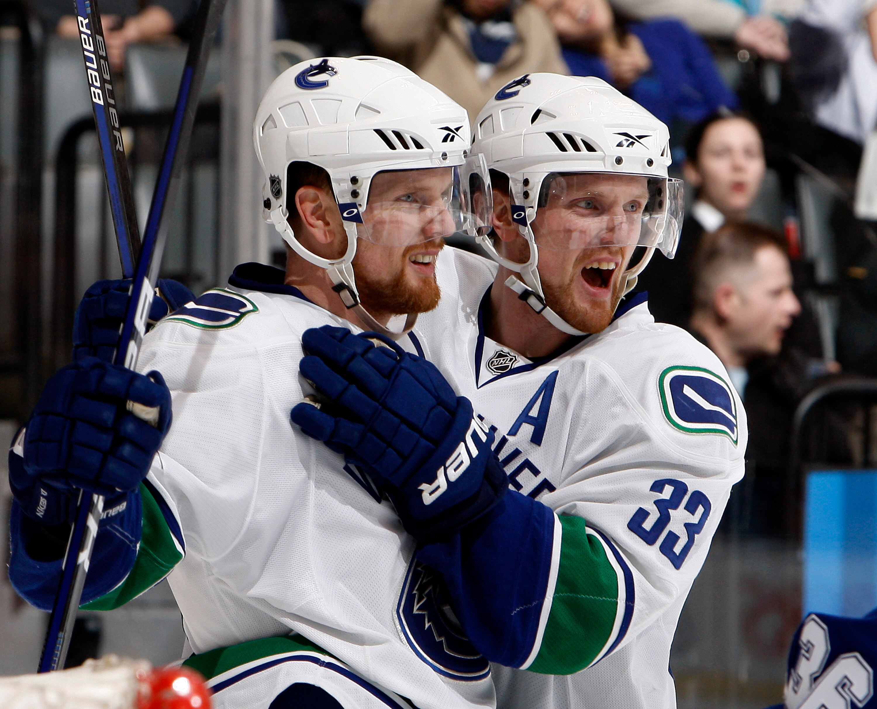 TORONTO - JANUARY 30: Henrik Sedin #33 and Daniel Sedin #22of the Vancouver Canucks celebrate goal during game action against the Toronto Maple Leafs January 30, 2010 at the Air Canada Centre in Toronto, Ontario, Canada. (Photo by Abelimages / Getty Image