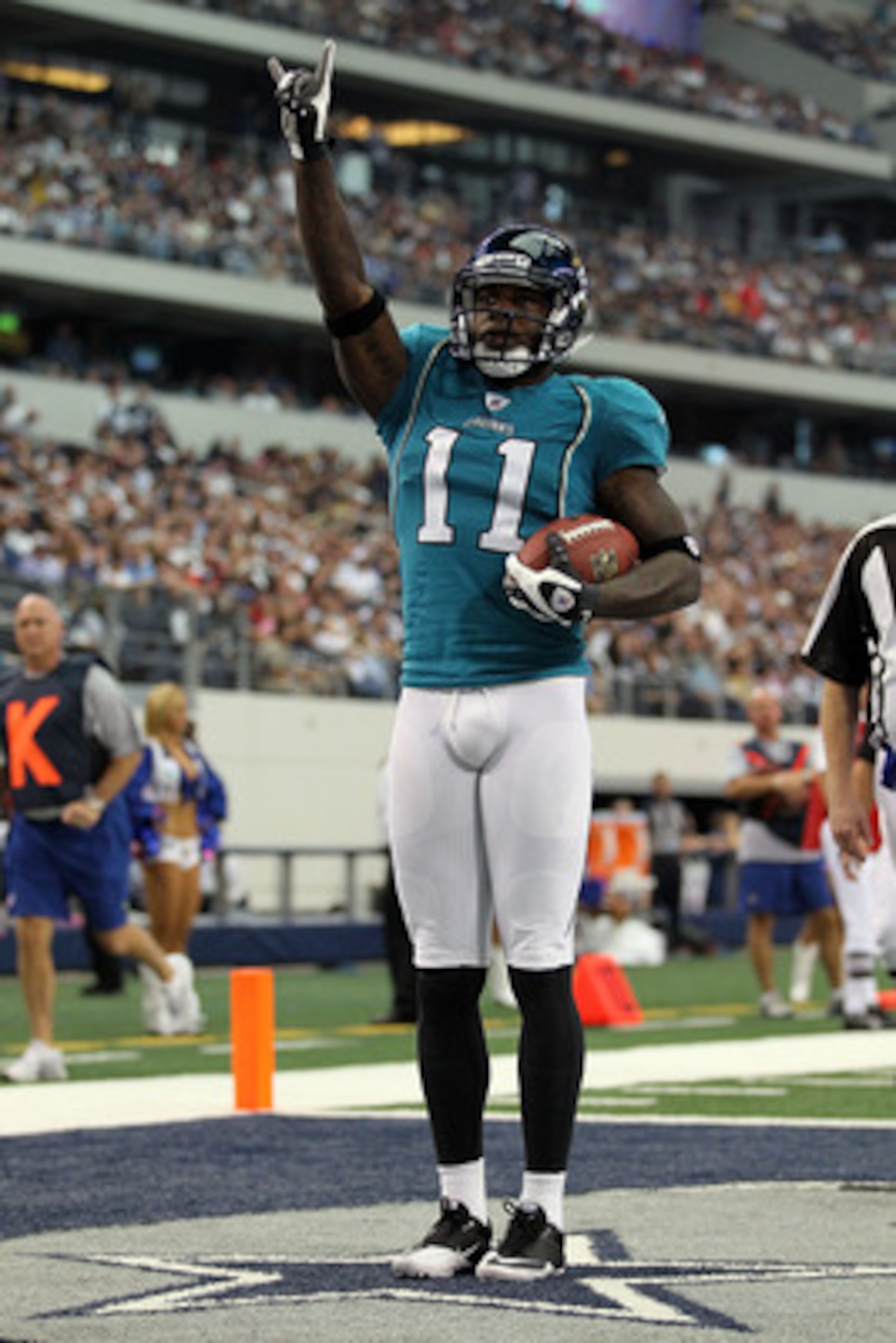 ARLINGTON, TX - OCTOBER 31:  Wide receiver Mike Sims-Walker #11 of the Jacksonville Jaguars celebrates a touchdown against the Dallas Cowboys in the first quarter at Cowboys Stadium on October 31, 2010 in Arlington, Texas.  (Photo by Ronald Martinez/Getty