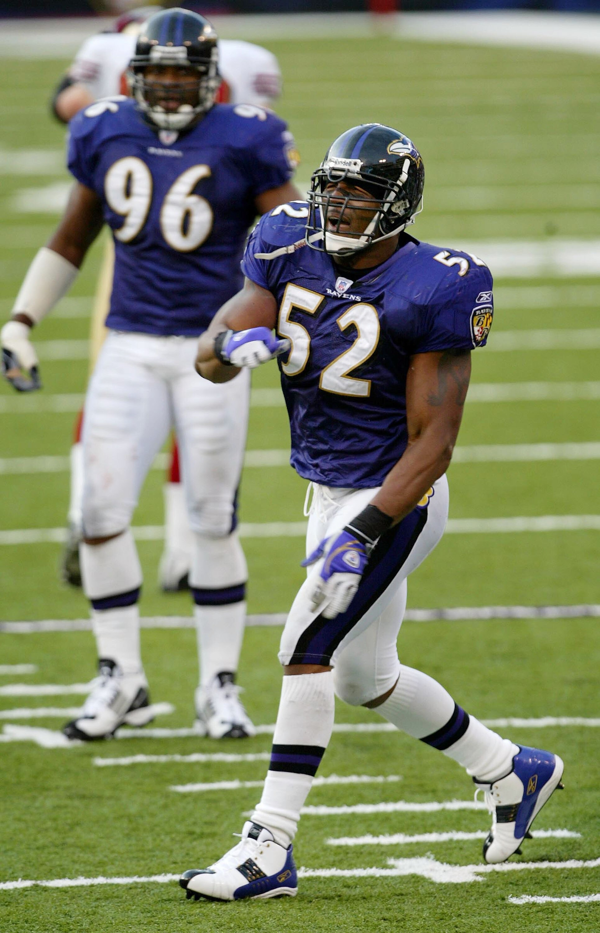 BALTIMORE - NOVEMBER 30:  Ray Lewis #52 of the Baltimore Ravens celebrates a tackle against the San Francisco 49ers as the Ravens defeated the 49ers 44-6 on November 30, 2003 at the M&T Bank Stadium in Baltimore, Maryland.  (Photo by Doug Pensinger/Getty