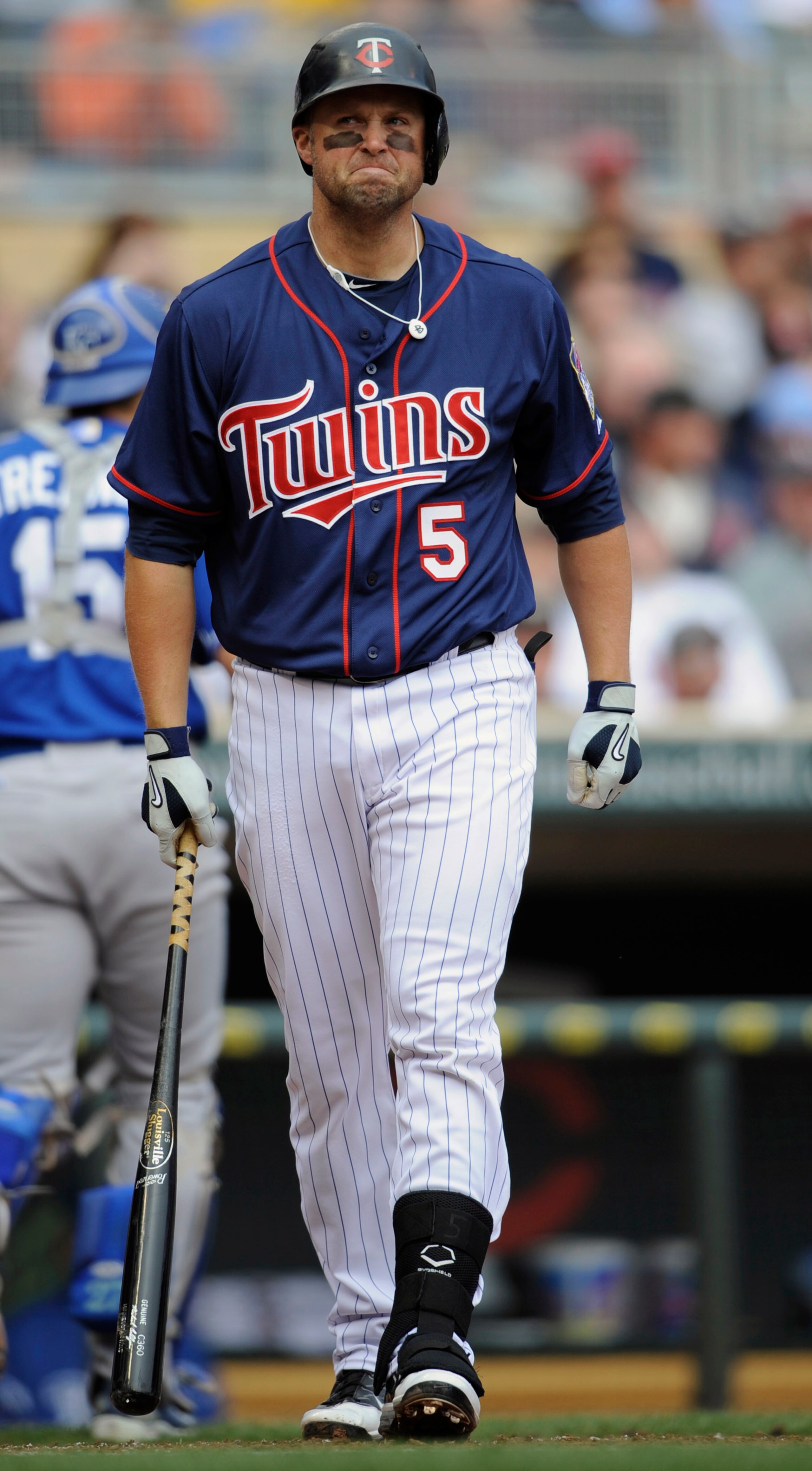 MINNEAPOLIS, MN - APRIL 13: Michael Cuddyer #5 of the Minnesota Twins reacts to a strikeout with the bases loaded against the Kansas City Royals during the first inning of their game on April 13, 2011 at Target Field in Minneapolis, Minnesota. (Photo by H