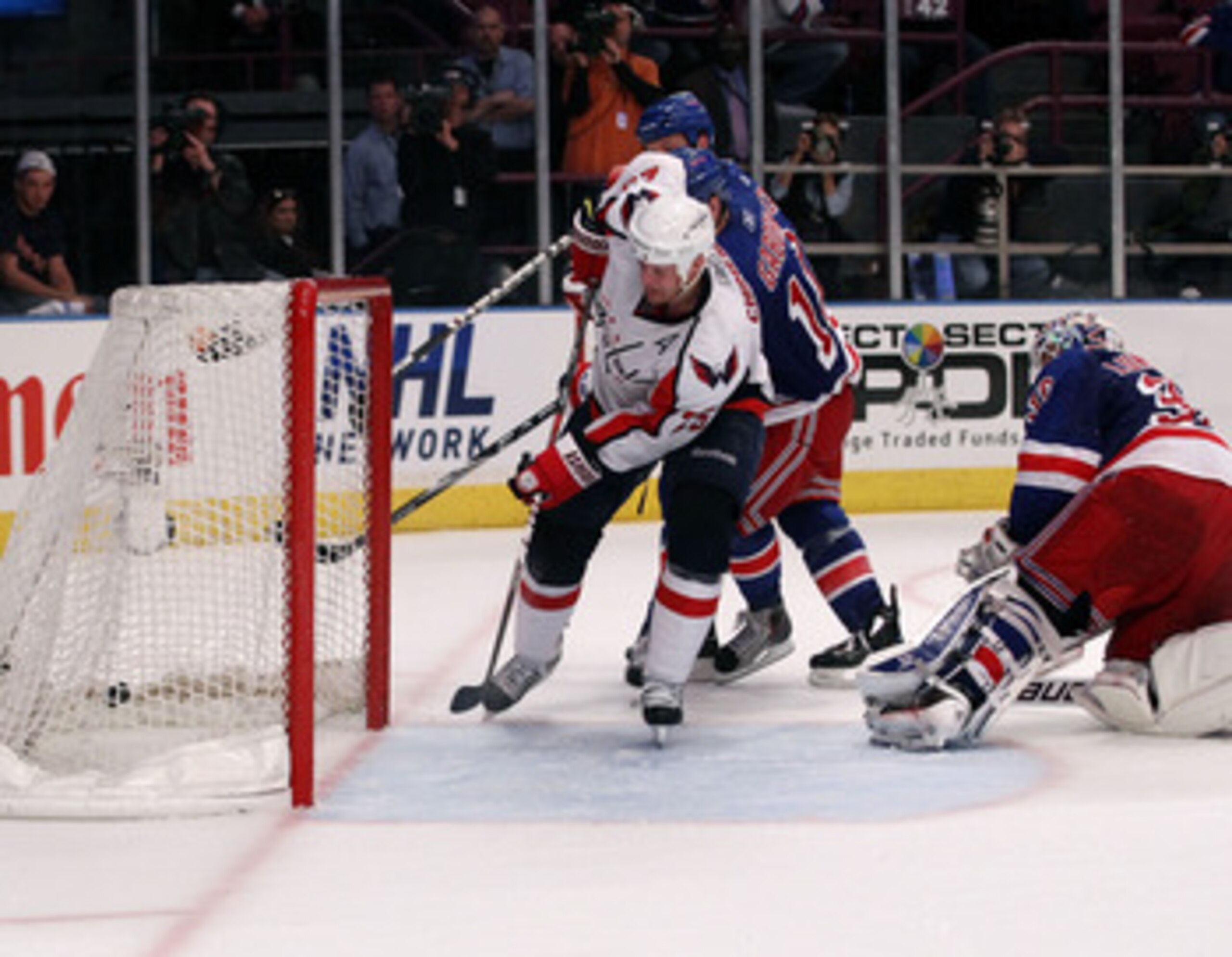 NEW YORK, NY - APRIL 20:  Jason Chimera #25 of the Washington Capitals scores the game-winning goal in the second overtime to win 4-3 against goalie Henrik Lundqvist #30 of the New York Rangers in Game Four of the Eastern Conference Quarterfinals during t