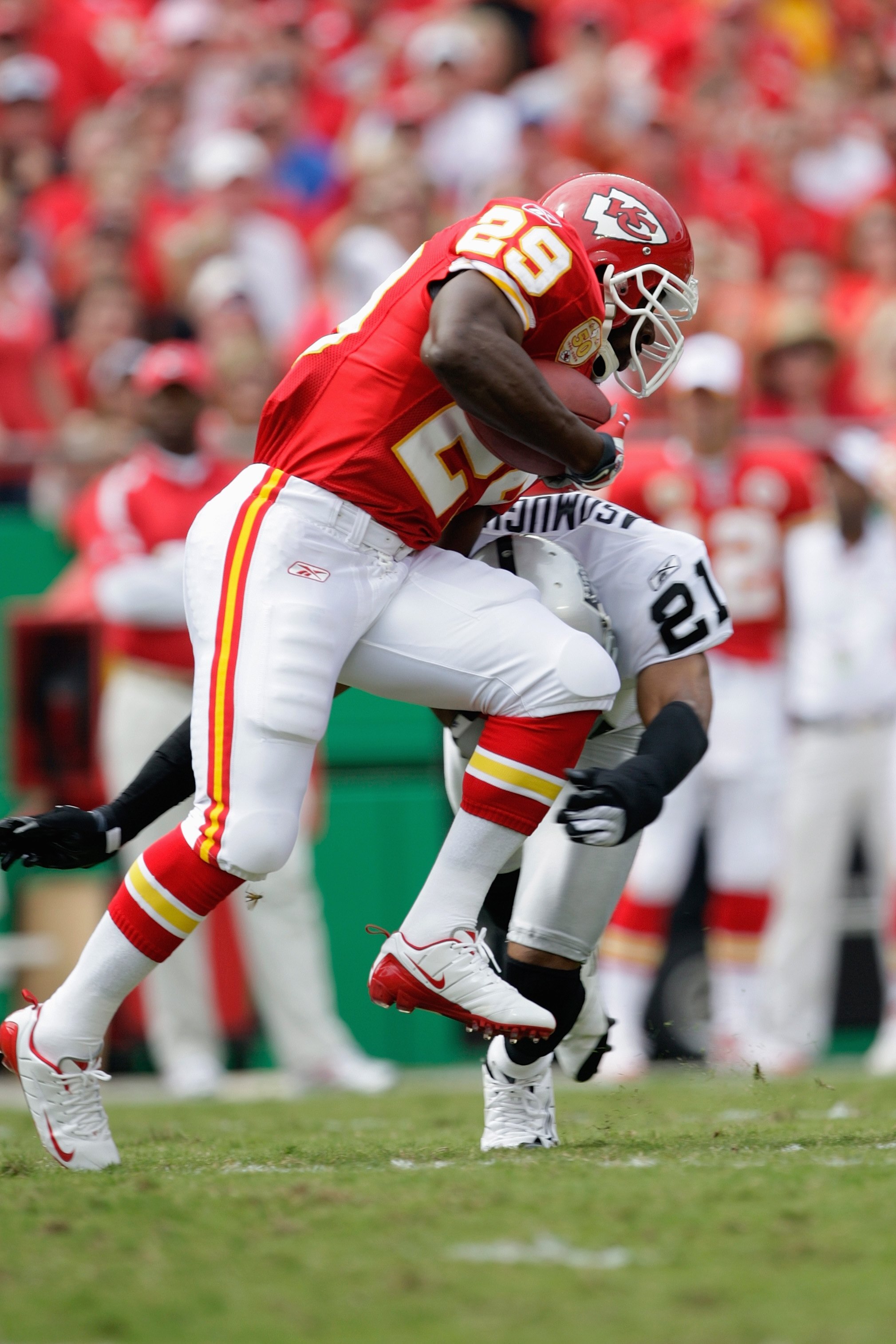 KANSAS CITY, MO - SEPTEMBER 20:  Dantrell Savage #29 of the Kansas City Chiefs carries the ball against Nnamdi Asomugha #21 of the Oakland Raiders during the game at Arrowhead Stadium on September 20, 2009 in Kansas City, Missouri. (Photo by Jamie Squire/