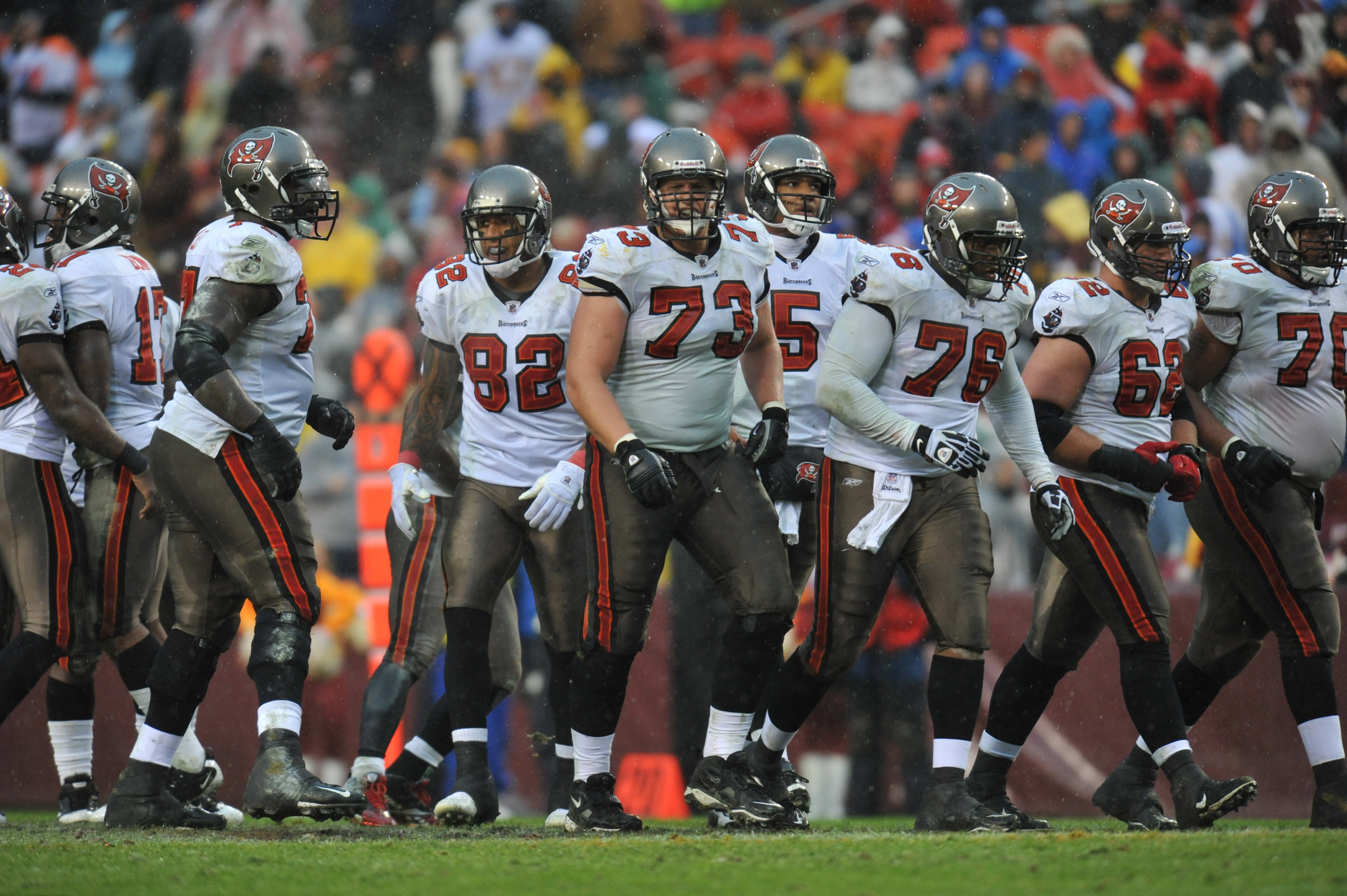 LANDOVER, MD - DECEMBER 12:  Derek Hardman #73 of the Tampa Bay Buccaneers walks up to the line of scrimmage with the defensive line during the game against the Washington Redskins  at FedExField on December 12, 2010 in Landover, Maryland. The Buccaneers
