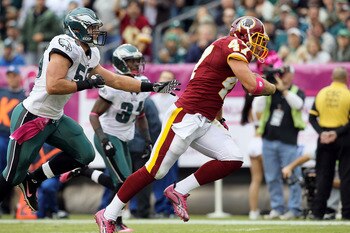 PHILADELPHIA - OCTOBER 03:  Chris Cooley #47 of the Washington Redskins runs in a reception for a first quarter touchdown past Stewart Bradley #55 of the Philadelphia Eagles on October 3, 2010 at Lincoln Financial Field in Philadelphia, Pennsylvania.  (Ph