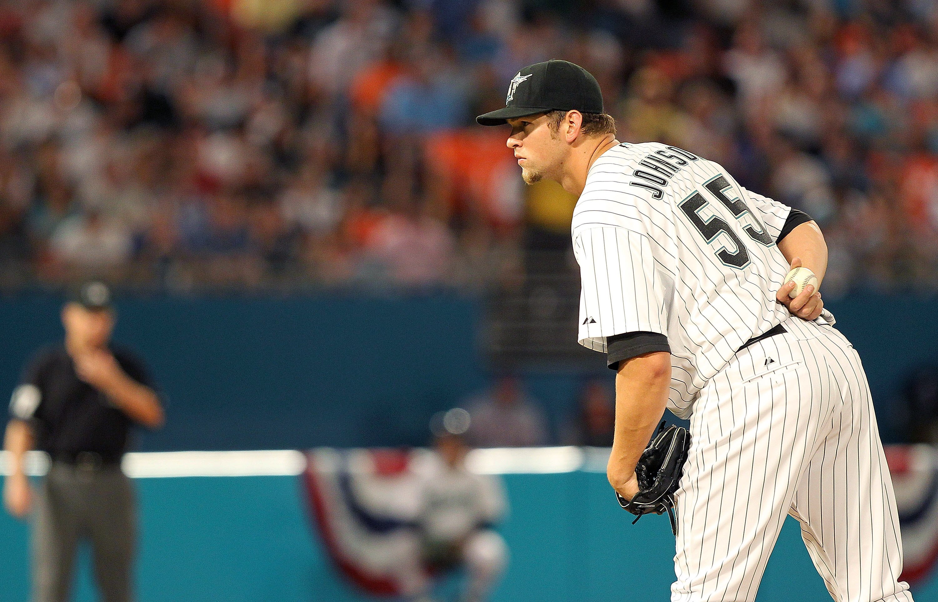 MIAMI GARDENS, FL - APRIL 01:  Josh Johnson #55 of the Florida Marlins pitches during opening day against the New York Mets at Sun Life Stadium on April 1, 2011 in Miami Gardens, Florida.  (Photo by Mike Ehrmann/Getty Images)