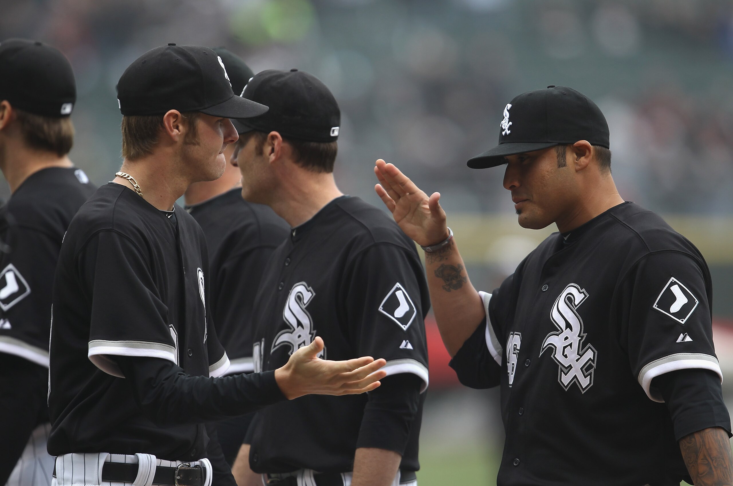 CHICAGO, IL - APRIL 07: Chris Sale #49 of the Chicago White Sox (L) is greeted by teammate Sergio Santos #46 during player introductions before the home opener against the Tampa Bay Rays at U.S. Cellular Field on April 7, 2011 in Chicago, Illinois. The Wh