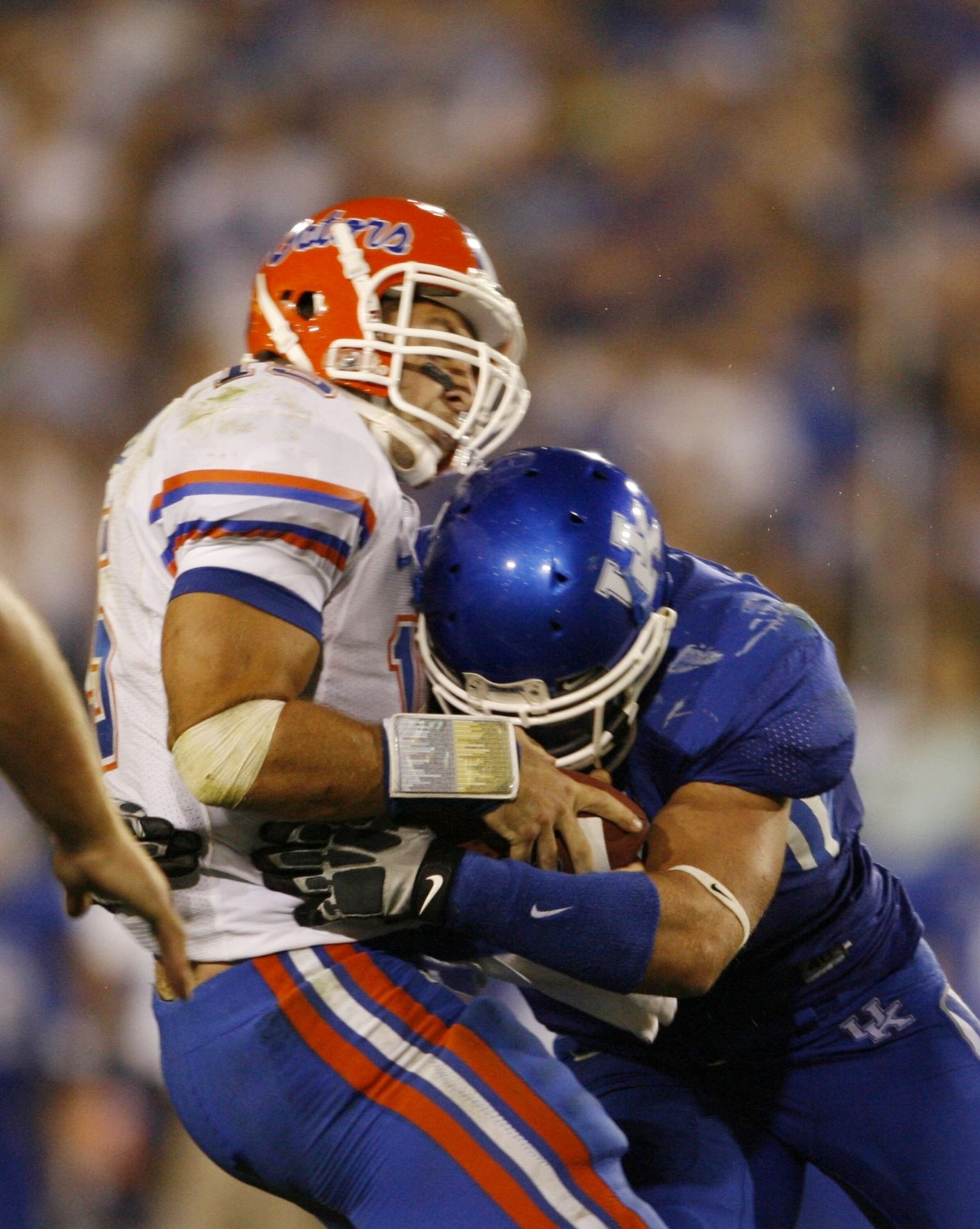 LEXINGTON, KY - SEPTEMBER 26: Quarterback Tim Tebow #15 of the Florida Gators is sacked by Taylor Wyndham #94 of the Kentucky Wildcats during the third quarter of the game at Commonwealth Stadium on September 26, 2009 in Lexington, Kentucky. (Photo by And