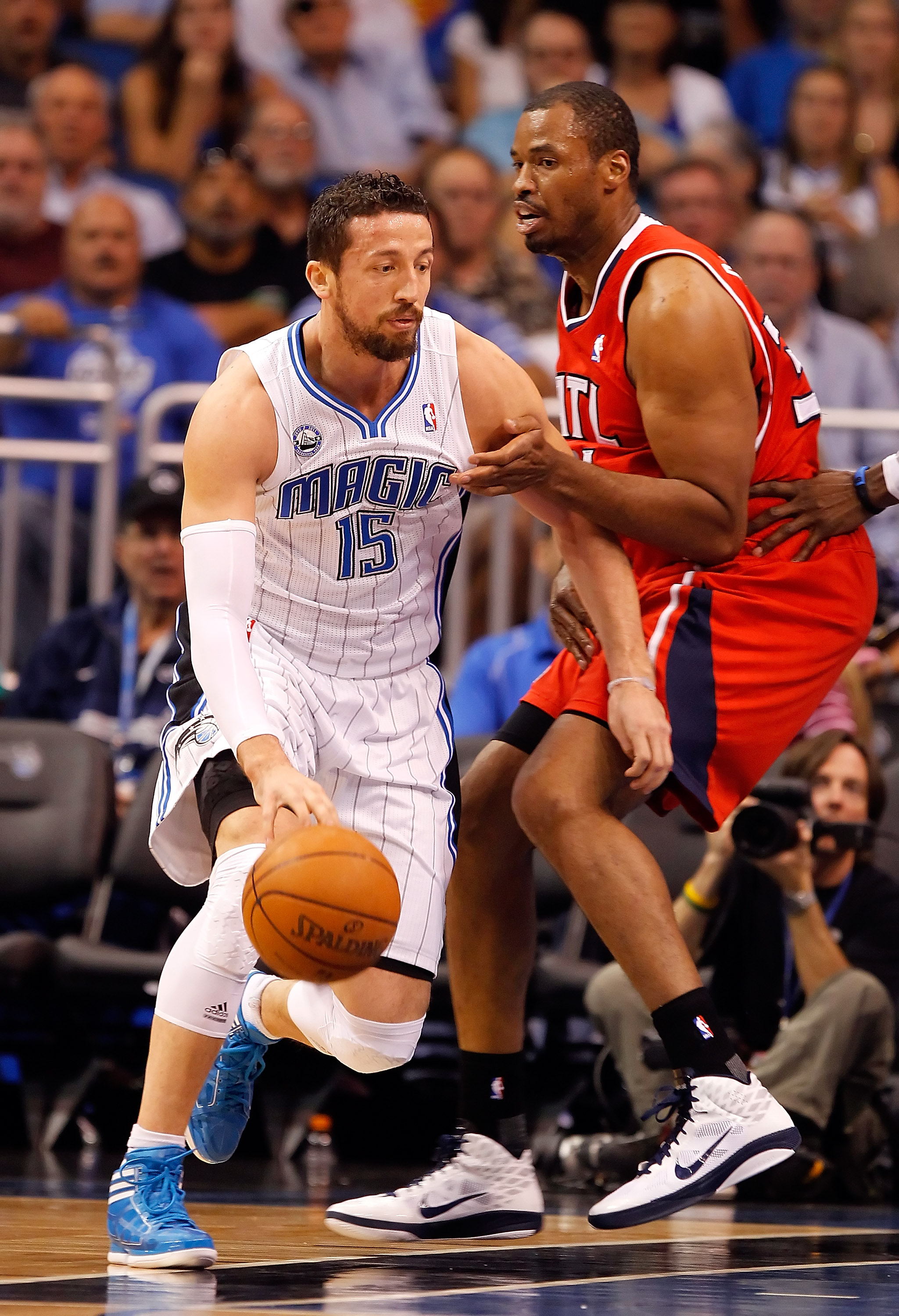 ORLANDO, FL - APRIL 16:  Hedo Turkoglu #15 of the Orlando Magic drives on Jason Collins #34 of the Atlanta Hawks during Game One of the Eastern Conference Quarterfinals of the 2011 NBA Playoffs on April 16, 2011 at the Amway Arena in Orlando, Florida.  NO