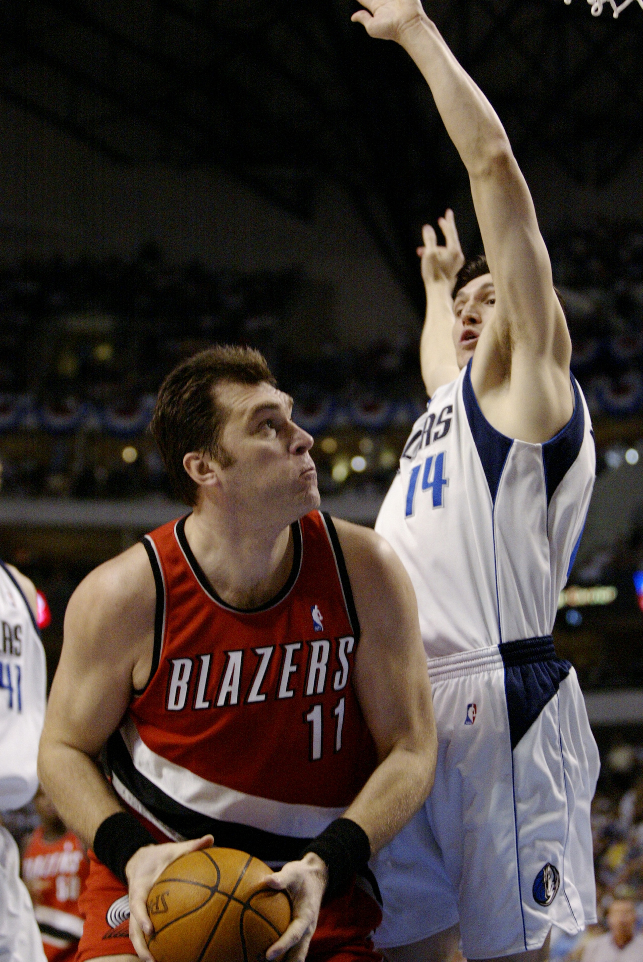 DALLAS - MAY 4: Arvydas Sabonis #11 of the Portland Trail Blazers attempts to go to the basket while being guarded by Eduardo Najera #14 of the Dallas Mavericks in Game seven of the Western Conference Quarterfinals during the 2003 NBA Playoffs at America DALLAS - MAY 4: Arvydas Sabonis #11 of the Portland Trail Blazers attempts to go to the basket while being guarded by Eduardo Najera #14 of the Dallas Mavericks in Game seven of the Western Conference Quarterfinals during the 2003 NBA Playoffs at America