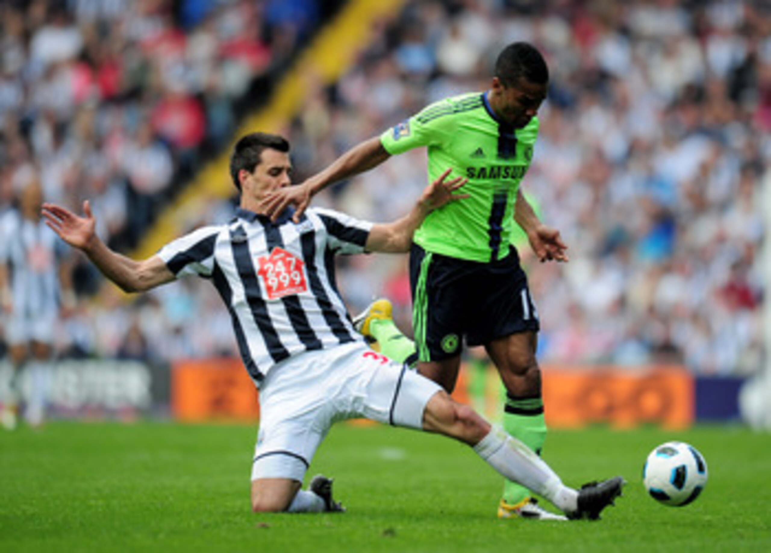 WEST BROMWICH, ENGLAND - APRIL 16:  Florent Malouda of Chelsea is tackled by Paul Scharner of West Bromwich Albion during the Barclays Premier League match between West Bromich Albion and Chelsea at The Hawthorns on April 16, 2011 in West Bromwich, Englan