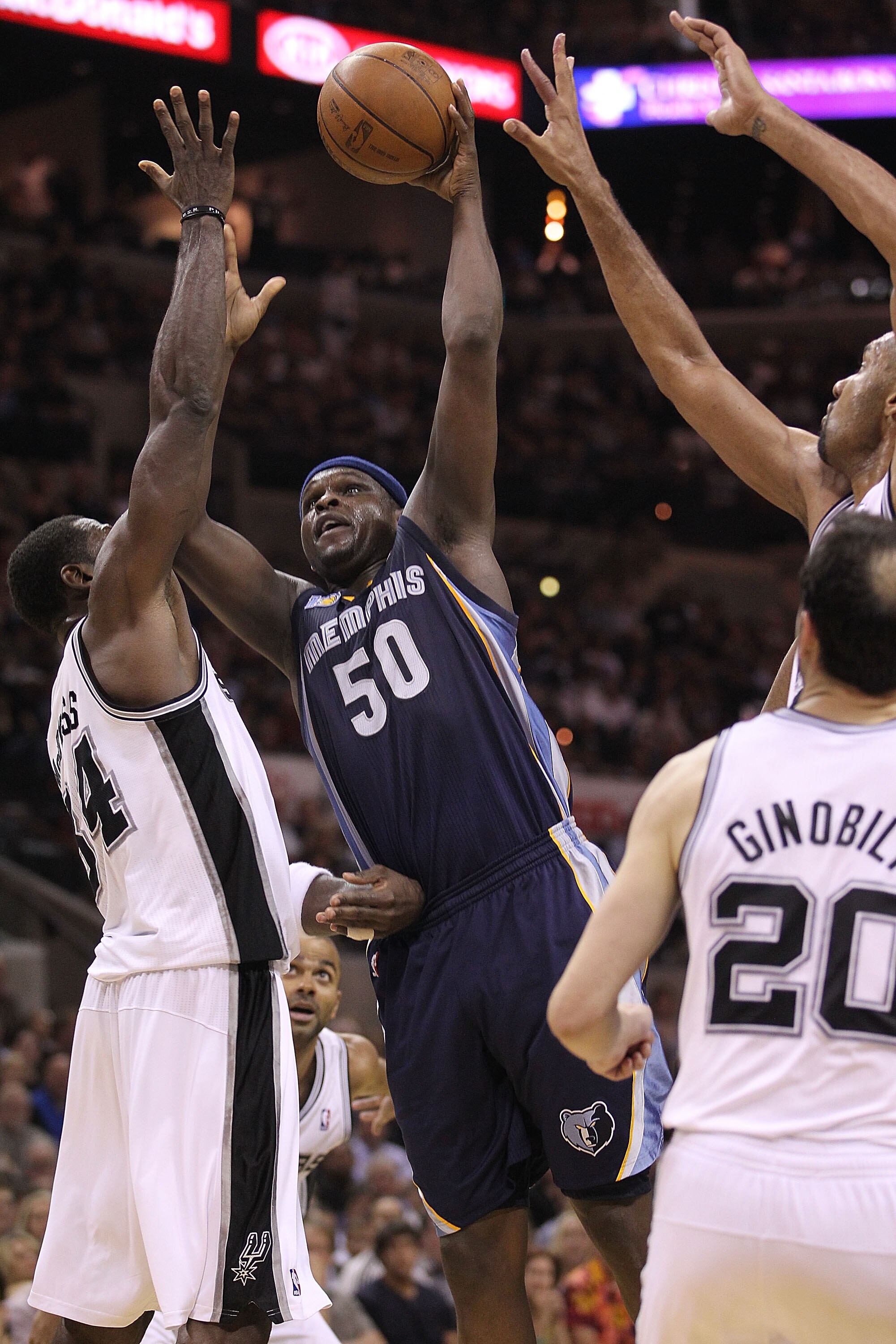 SAN ANTONIO, TX - APRIL 20:  Forward Zach Randolph #50 of the Memphis Grizzlies takes a shot against Antonio McDyess #34 of the San Antonio Spurs in Game Two of the Western Conference Quarterfinals in the 2011 NBA Playoffs on April 20, 2011 at AT&T Center