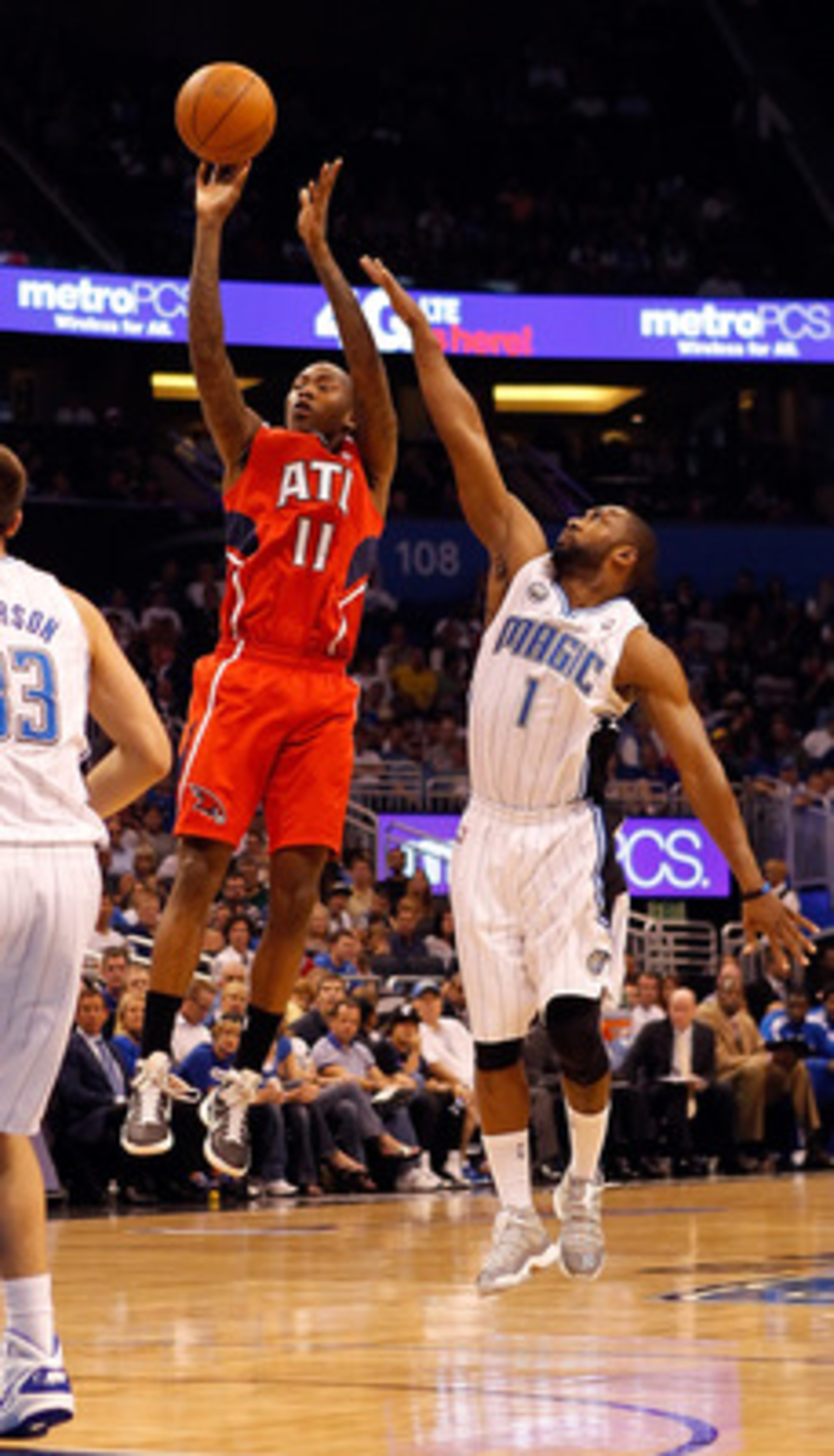 ORLANDO, FL - APRIL 16:  Jamal Crawford #11 of the Atlanta Hawks shoots over Gilbert Arenas #1 of the Orlando Magic during Game One of the Eastern Conference Quarterfinals of the 2011 NBA Playoffs on April 16, 2011 at the Amway Arena in Orlando, Florida.