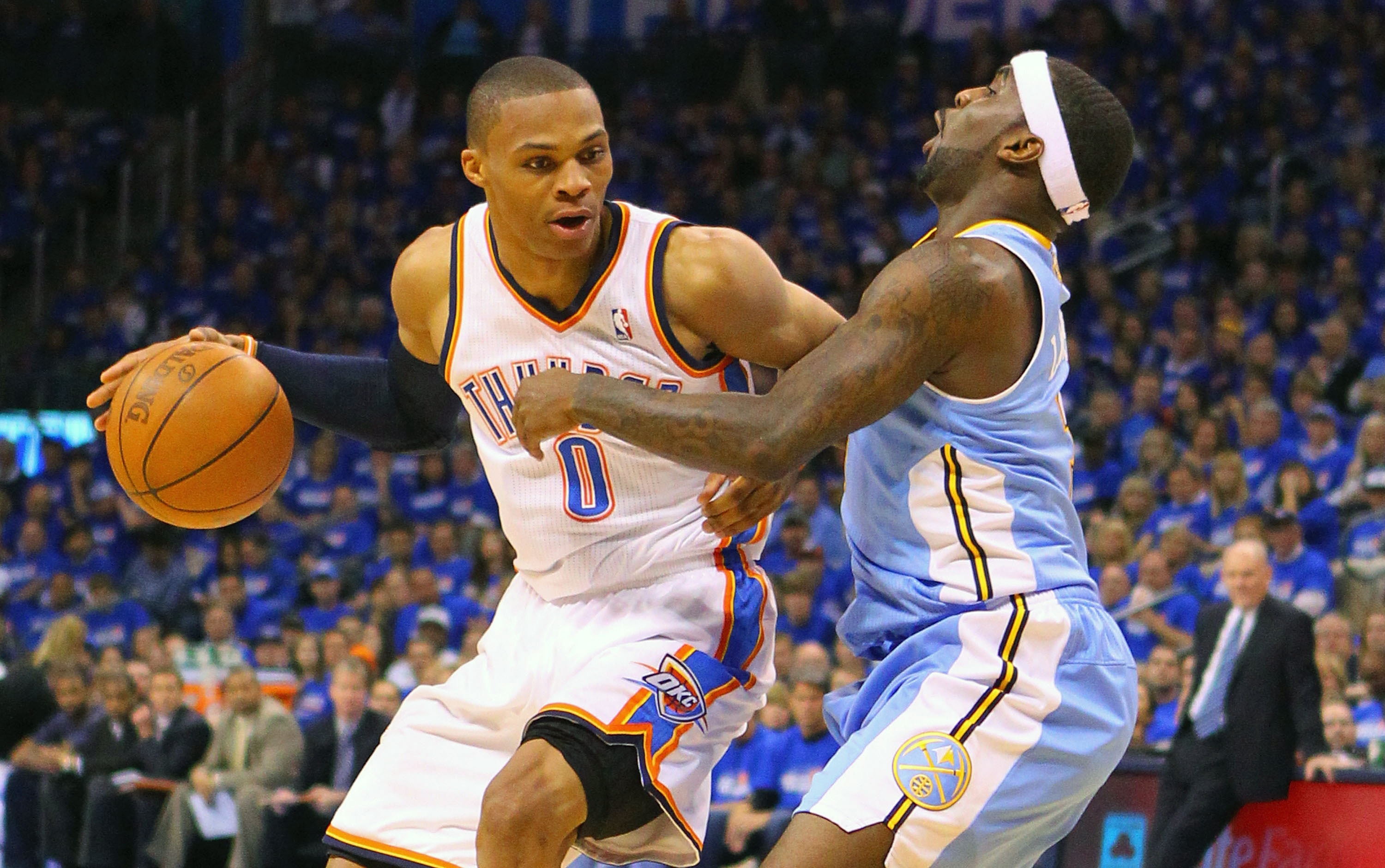 OKLAHOMA CITY, OK - APRIL 20: Russell Westbrook #0 oo\ fouls Ty Lawson #3 of the Denver Nuggets in Game Two of the Western Conference Quarterfinals in the 2011 NBA Playoffs on April 20, 2011 at the Ford Center in Oklahoma City, Oklahoma. NOTE TO USER: Use