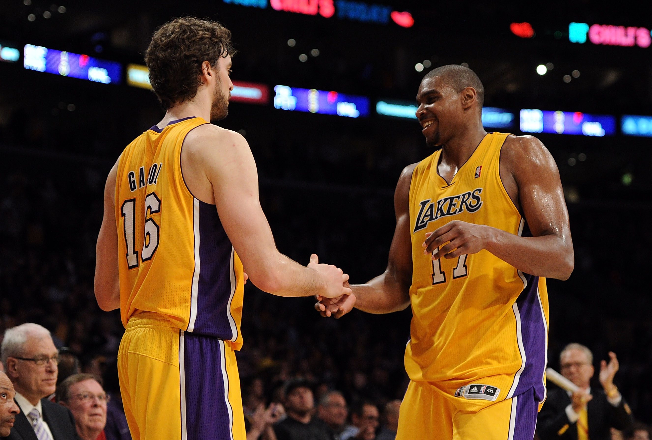 LOS ANGELES, CA - APRIL 20:  Pau Gasol #16 and Andrew Bynum #17 of the Los Angeles Lakers celebrate as Bynum comes to the bench while taking on the New Orleans Hornets in Game Two of the Western Conference Quarterfinals in the 2011 NBA Playoffs on April 2