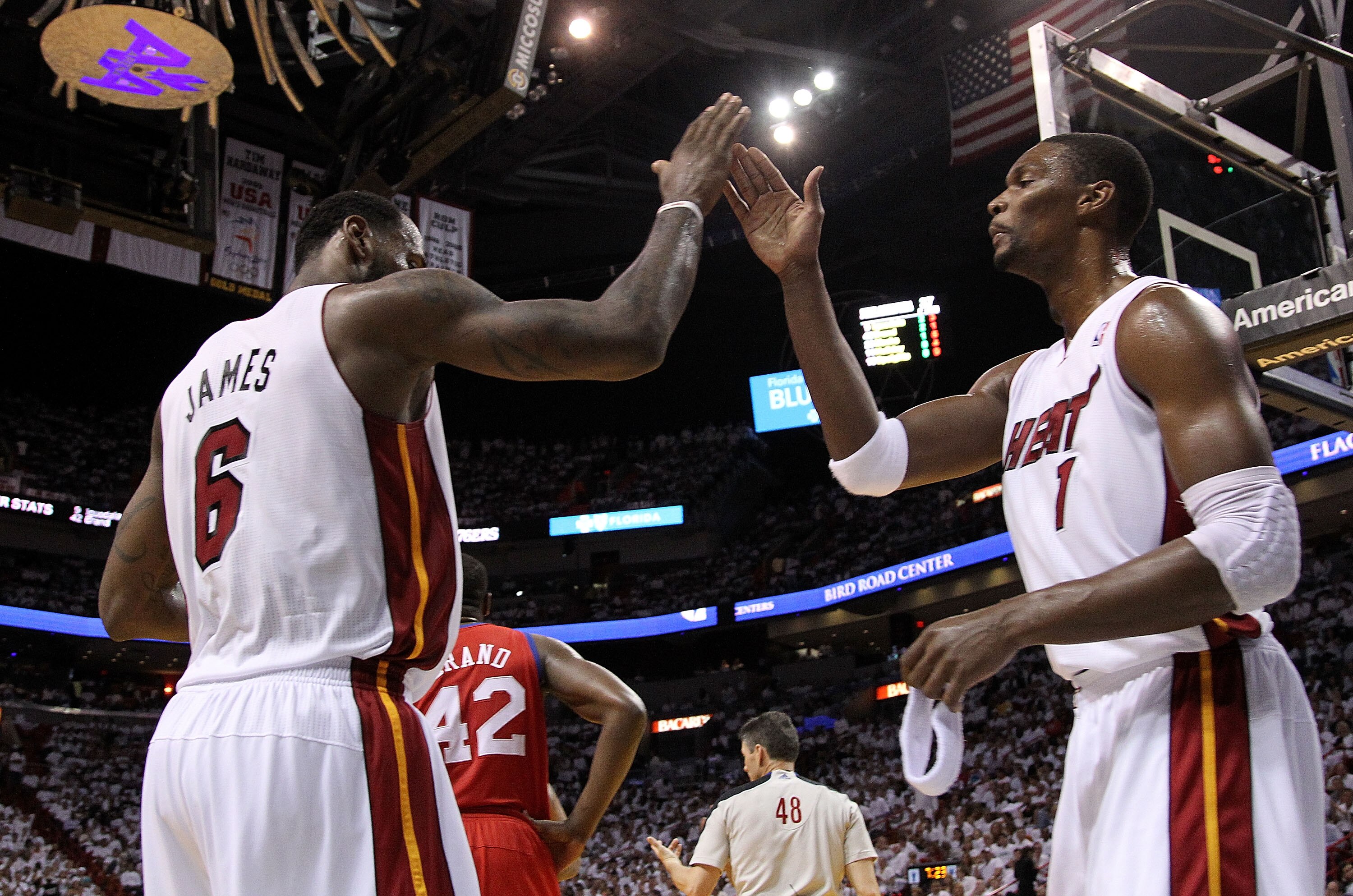 MIAMI, FL - APRIL 18:  LeBron James #6 and Chris Bosh #1 of the Miami Heat high five during game two of the Eastern Conference Quarterfinals against the Philadelphia 76ers at American Airlines Arena on April 18, 2011 in Miami, Florida. NOTE TO USER: User
