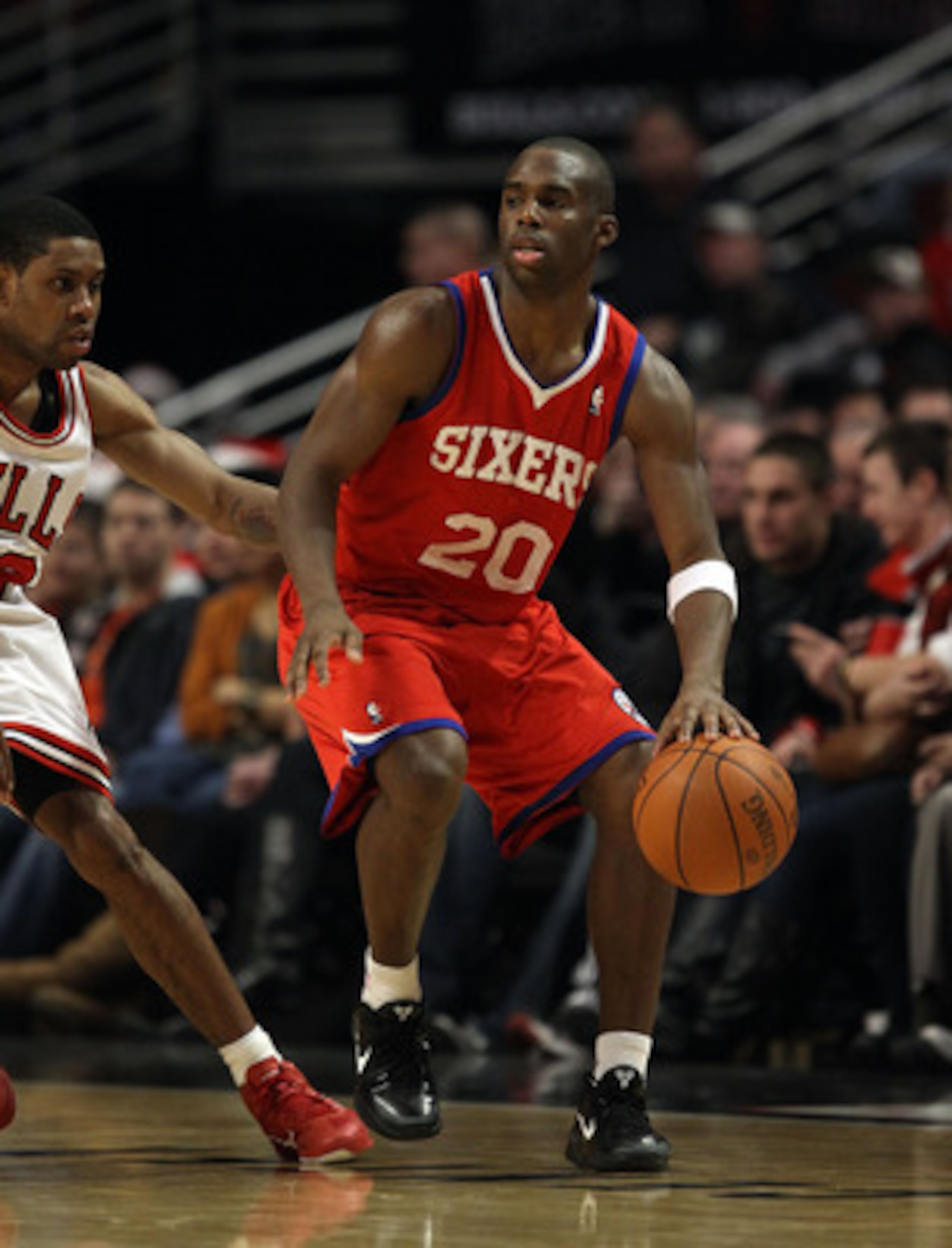 CHICAGO, IL - DECEMBER 21: Jodie Meeks #20 of the Philadelphia 76ers moves against C.J. Watson #32 of the Chicago Bulls at the United Center on December 21, 2010 in Chicago, Illinois. The Bulls defeated the 76ers 121-76. NOTE TO USER: User expressly ackno CHICAGO, IL - DECEMBER 21: Jodie Meeks #20 of the Philadelphia 76ers moves against C.J. Watson #32 of the Chicago Bulls at the United Center on December 21, 2010 in Chicago, Illinois. The Bulls defeated the 76ers 121-76. NOTE TO USER: User expressly ackno