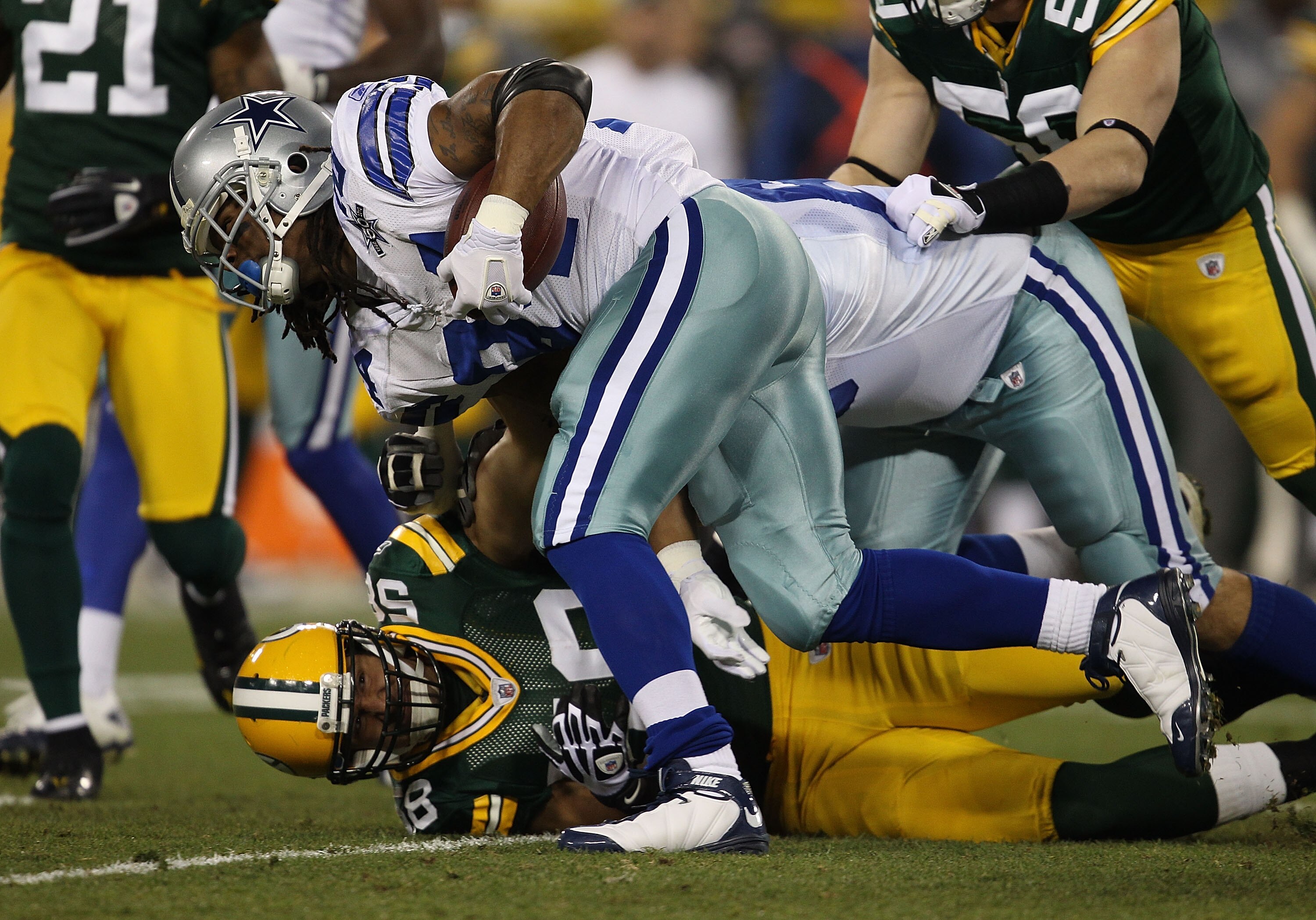 GREEN BAY, WI - NOVEMBER 07: Marion Barber #24 of the Dallas Cowboys is tackled by Frank Zombo #58 of the Green Bay Packers at Lambeau Field on November 7, 2010 in Green Bay, Wisconsin. The Packers defeated the Cowboys 45-7. (Photo by Jonathan Daniel/Gett