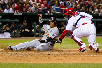 ST. LOUIS, MO - APRIL 4: Jose Tabata #31 of the Pittsburgh Pirates is tagged out at home Yadier Molina #4 of the St. Louis Cardinals at Busch Stadium on April 4, 2011 in St. Louis, Missouri.  (Photo by Dilip Vishwanat/Getty Images)