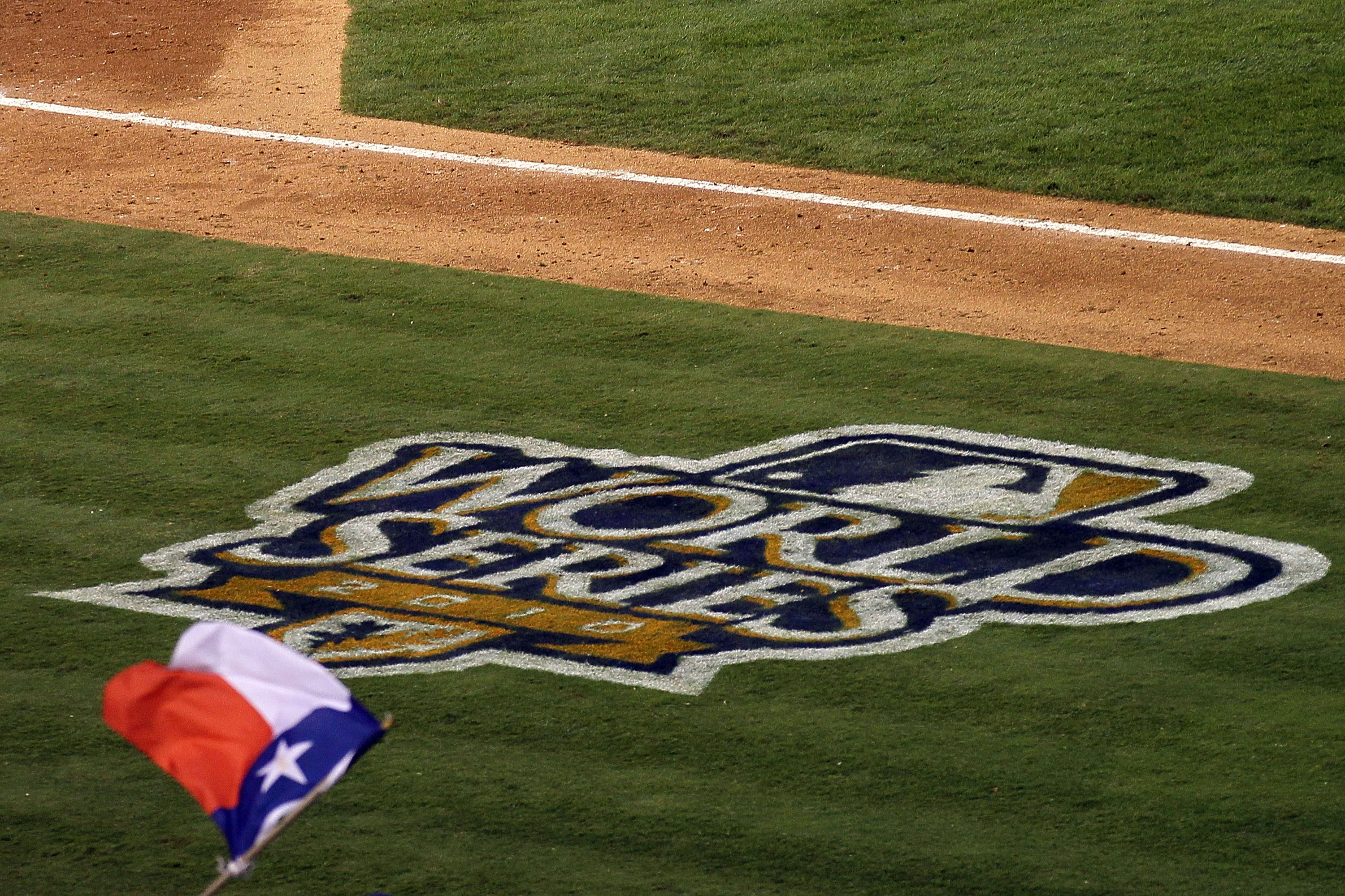 ARLINGTON, TX - OCTOBER 31:  A fan of the Texas Rangers waves a Texas flag during their game against the San Francisco Giants in Game Four of the 2010 MLB World Series at Rangers Ballpark in Arlington on October 31, 2010 in Arlington, Texas.  (Photo by St