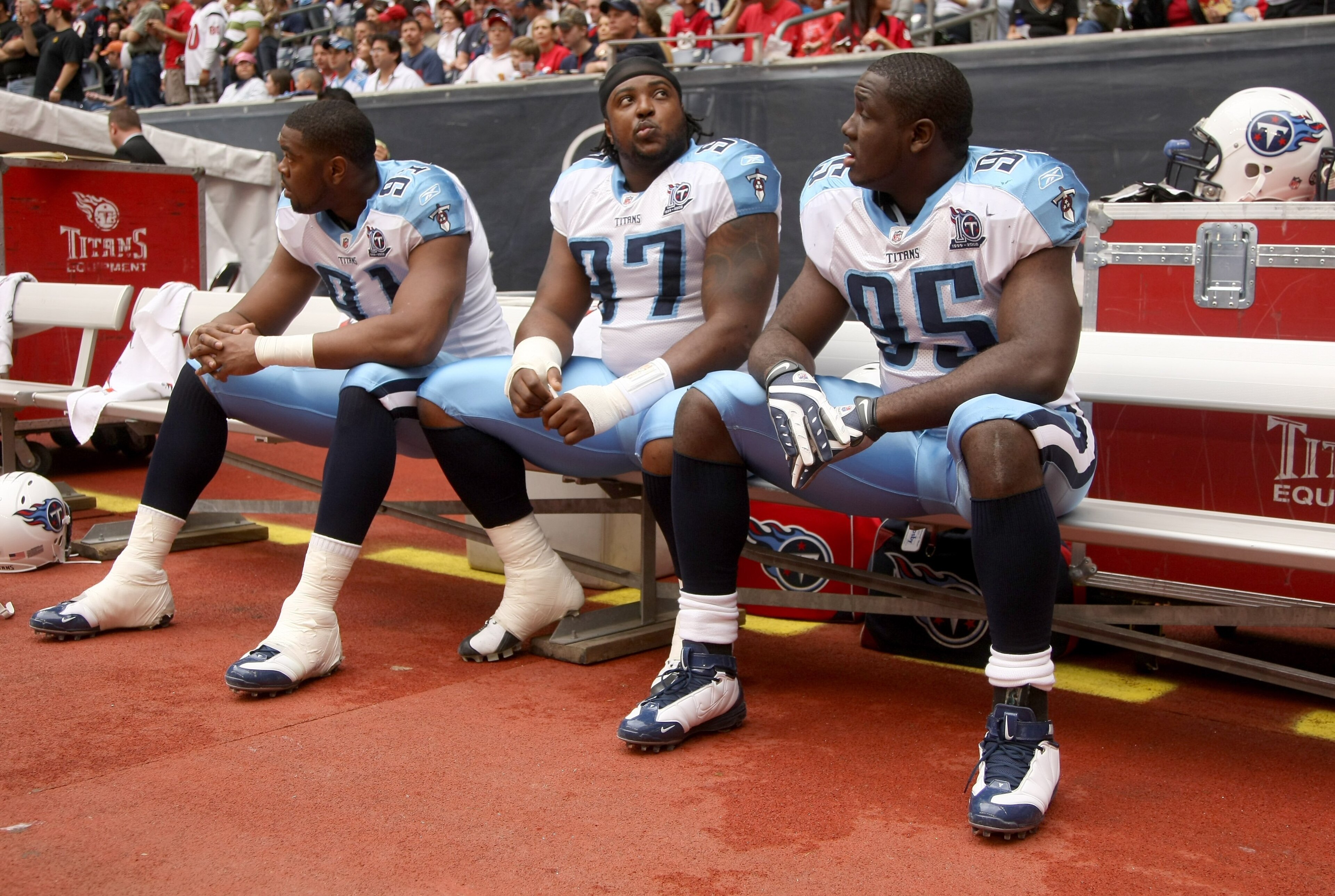 HOUSTON - DECEMBER 14:  Defensive linemen Jason Jones #91, Tony Brown #97 and William Hayes #95 of the Tennessee Titans sit on the bench before the game against the Houston Texans on December 14, 2008 at Reliant Stadium in Houston, Texas.  (Photo by Steph
