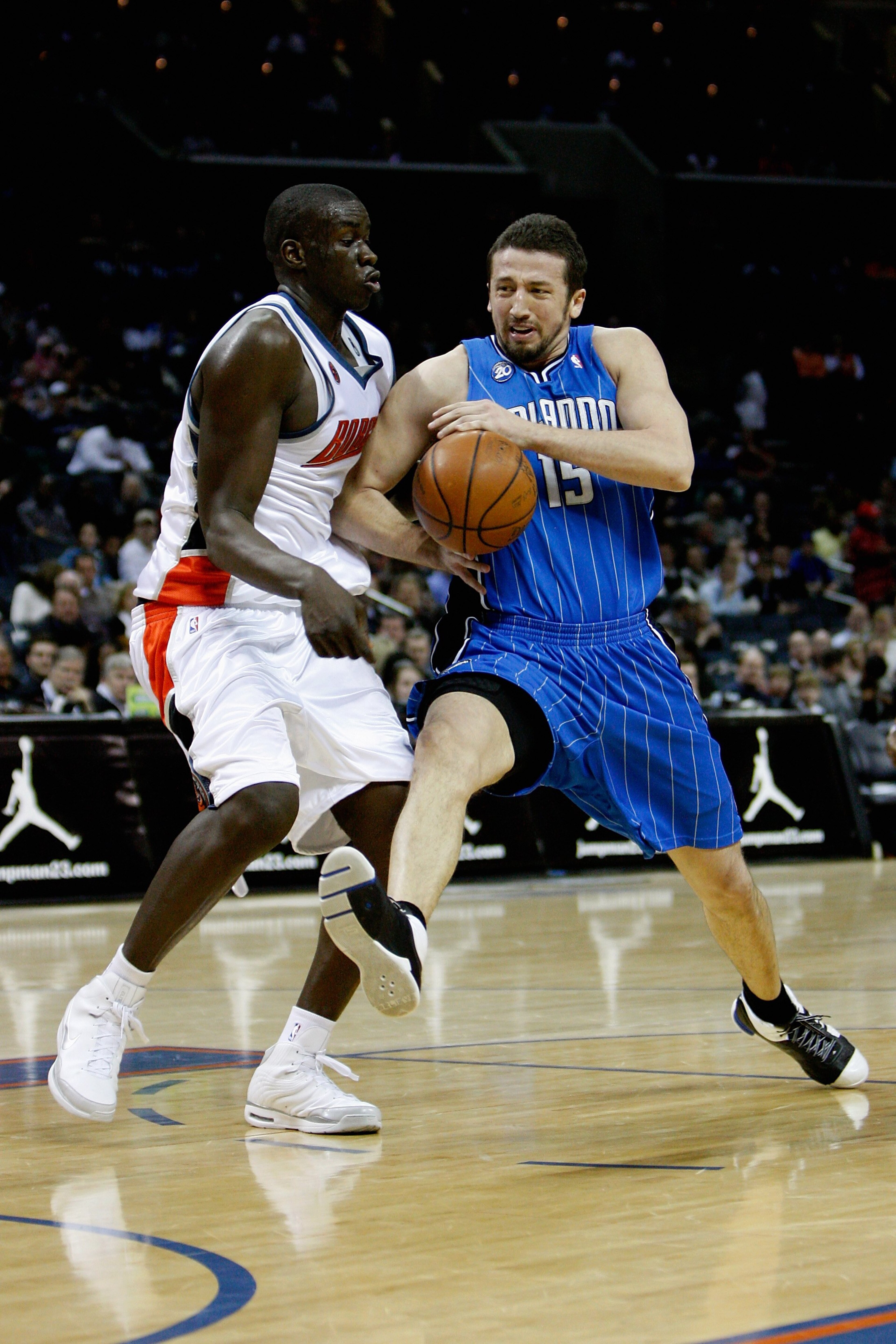 CHARLOTTE, NC - FEBRUARY 20: Hedo Turkoglur #15 of the Orlando Magic drives to the basket past DeSagana Diop #7 of the Charlotte Bobcats during their game on February 20, 2009 at Time Warner Cable Arena in Charlotte, North Carolina. The Magic won 92-80 CHARLOTTE, NC - FEBRUARY 20: Hedo Turkoglur #15 of the Orlando Magic drives to the basket past DeSagana Diop #7 of the Charlotte Bobcats during their game on February 20, 2009 at Time Warner Cable Arena in Charlotte, North Carolina. The Magic won 92-80