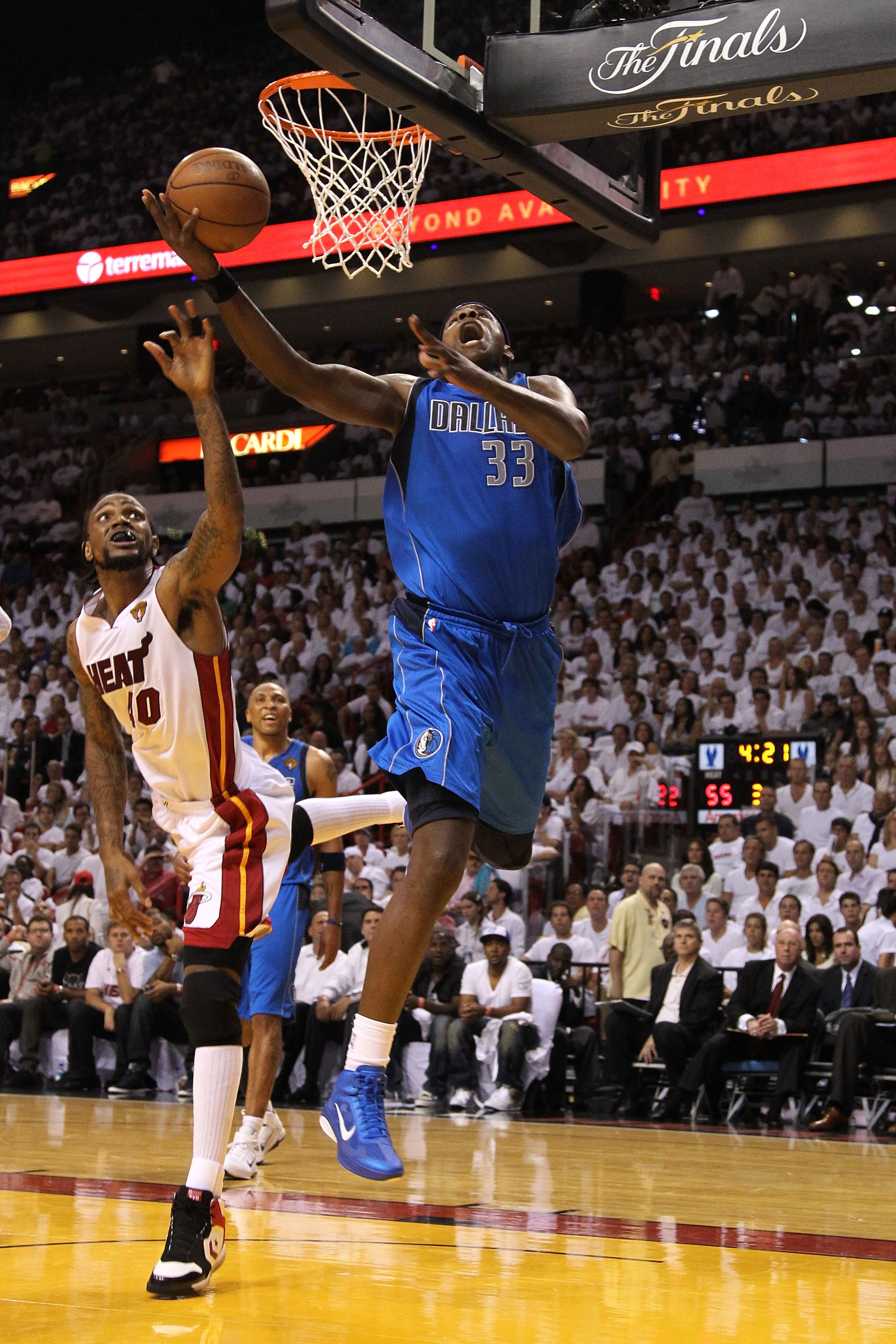 MIAMI, FL - MAY 31:  Brendan Haywood #33 of the Dallas Mavericks goes up for a shot against Udonis Haslem #40 of the Miami Heat in the third quarter in Game One of the 2011 NBA Finals at American Airlines Arena on May 31, 2011 in Miami, Florida. NOTE TO U