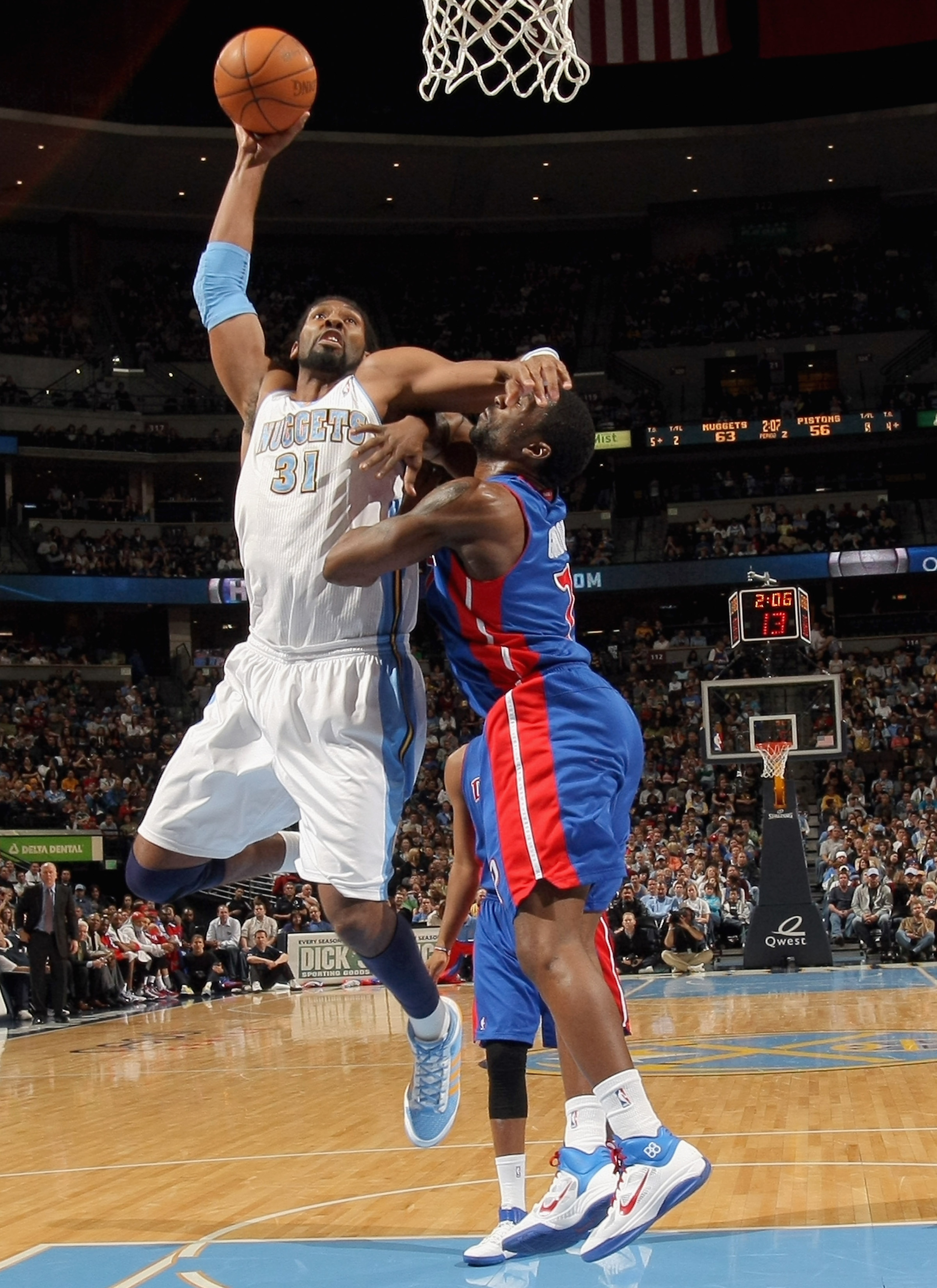 DENVER, CO - MARCH 12: Nene #31 of the Denver Nuggets is fouled by Ben Gordon #7 of the Detroit Pistons as he goes to the basket at the Pepsi Center on March 12, 2011 in Denver, Colorado. NOTE TO USER: User expressly acknowledges and agrees that, by down DENVER, CO - MARCH 12: Nene #31 of the Denver Nuggets is fouled by Ben Gordon #7 of the Detroit Pistons as he goes to the basket at the Pepsi Center on March 12, 2011 in Denver, Colorado. NOTE TO USER: User expressly acknowledges and agrees that, by down