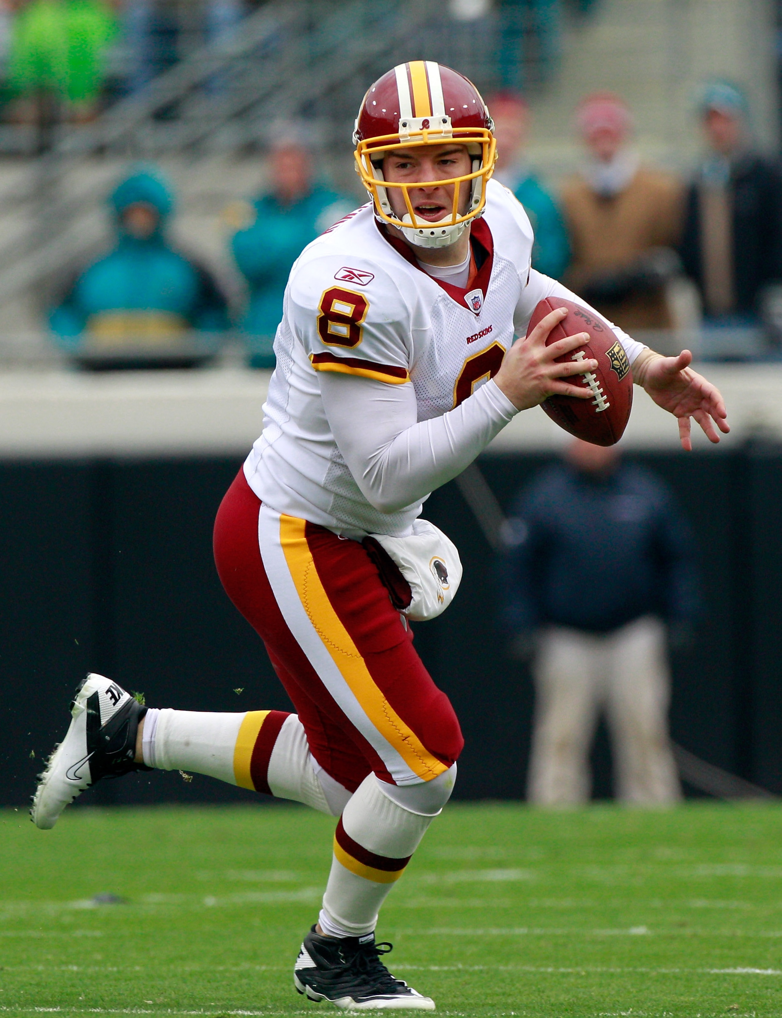 JACKSONVILLE, FL - DECEMBER 26: Quarterback Rex Grossman #8 of the Washington Redskins scrambles for yardage during the game against the Jacksonville Jaguars at EverBank Field on December 26, 2010 in Jacksonville, Florida.  (Photo by Sam Greenwood/Getty I