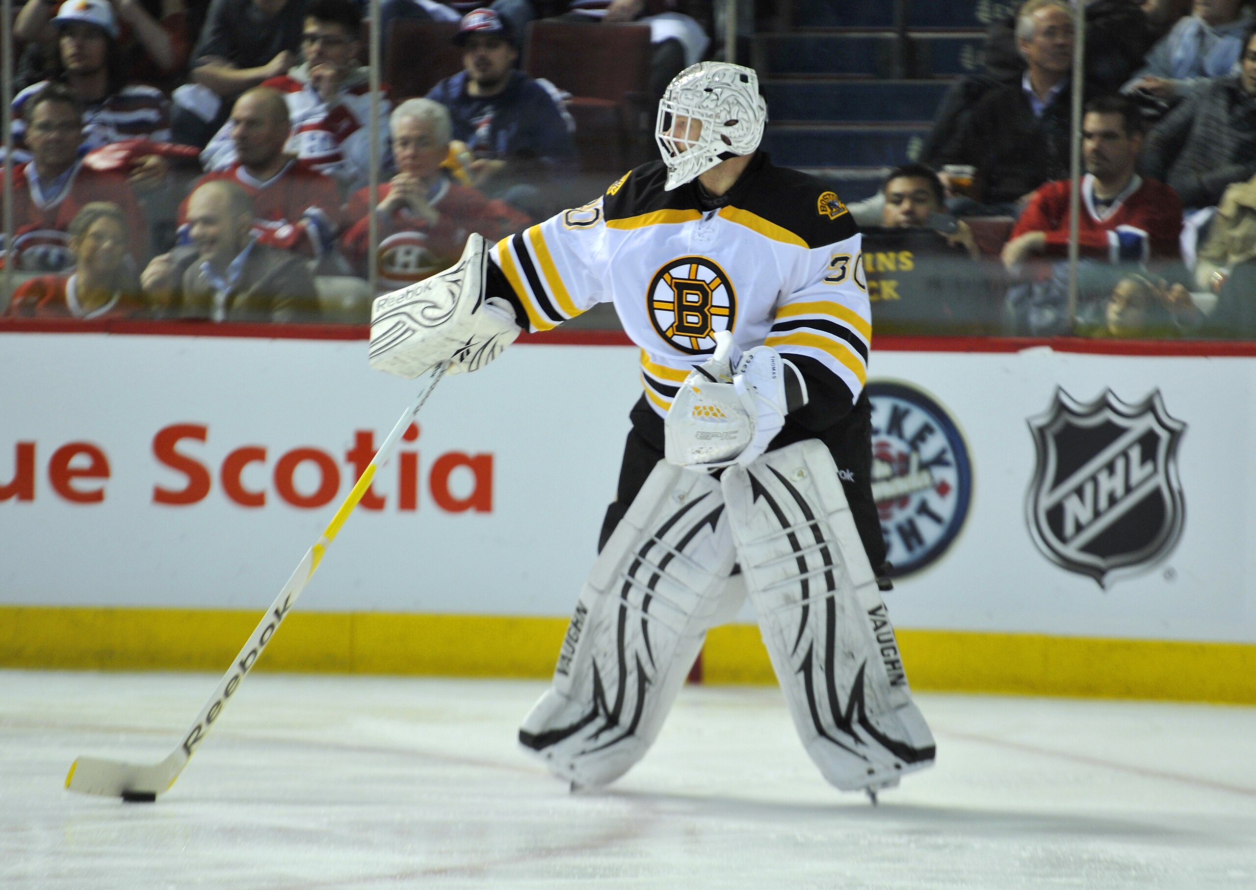 MONTREAL, CANADA - APRIL 18:  Tim Thomas #30 of the Boston Bruins controls the puck in his zone in Game Three of the Eastern Conference Quarterfinals against the Montreal Canadiens during the 2011 NHL Stanley Cup Playoffs at the Bell Centre on April 18, 2