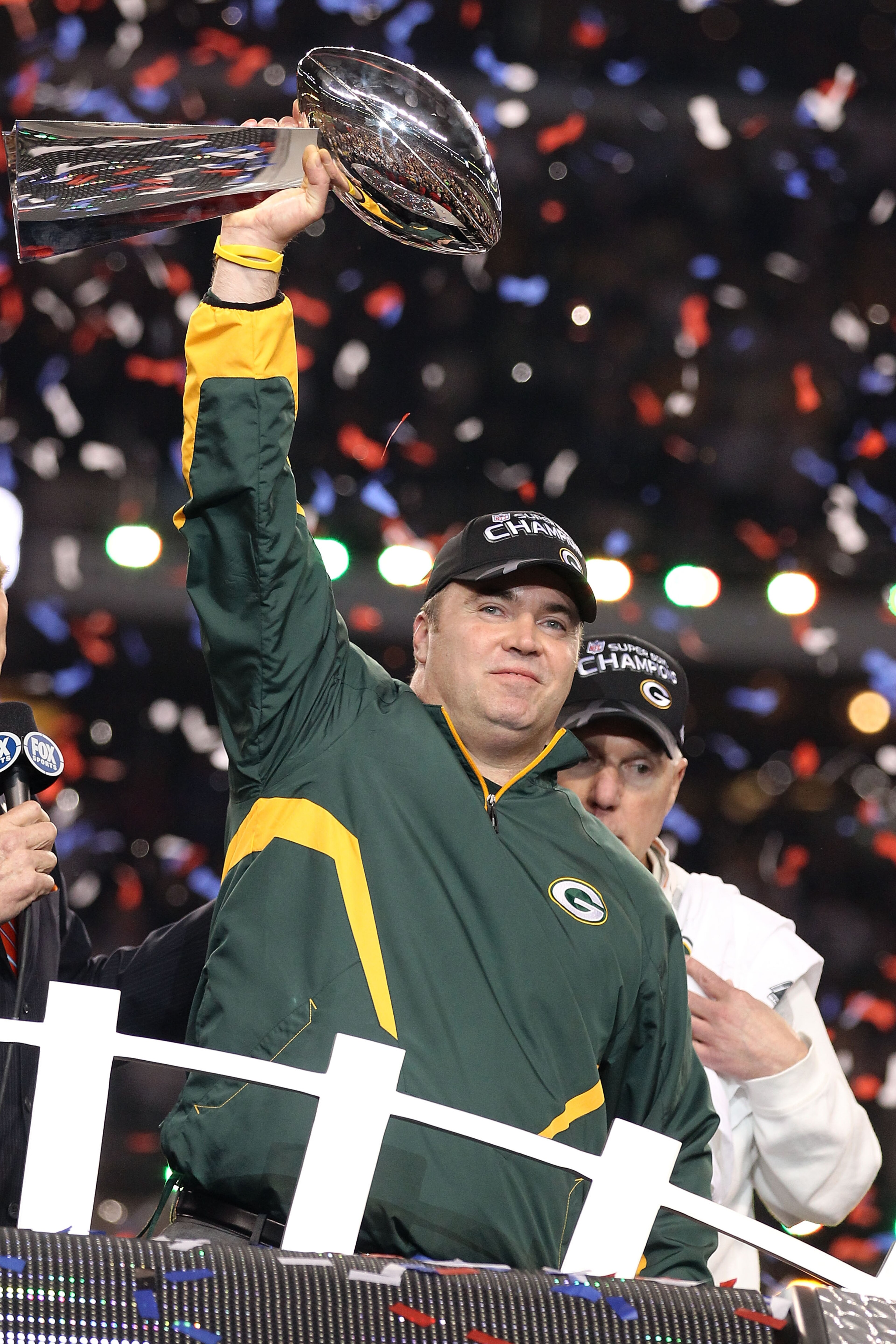 ARLINGTON, TX - FEBRUARY 06: Head coach Mike McCarthy of the Green Bay Packers holds up the Vince Lombardi Trophy after winning Super Bowl XLV 31-25 against the Pittsburgh Steelers at Cowboys Stadium on February 6, 2011 in Arlington, Texas.  (Photo by Al 