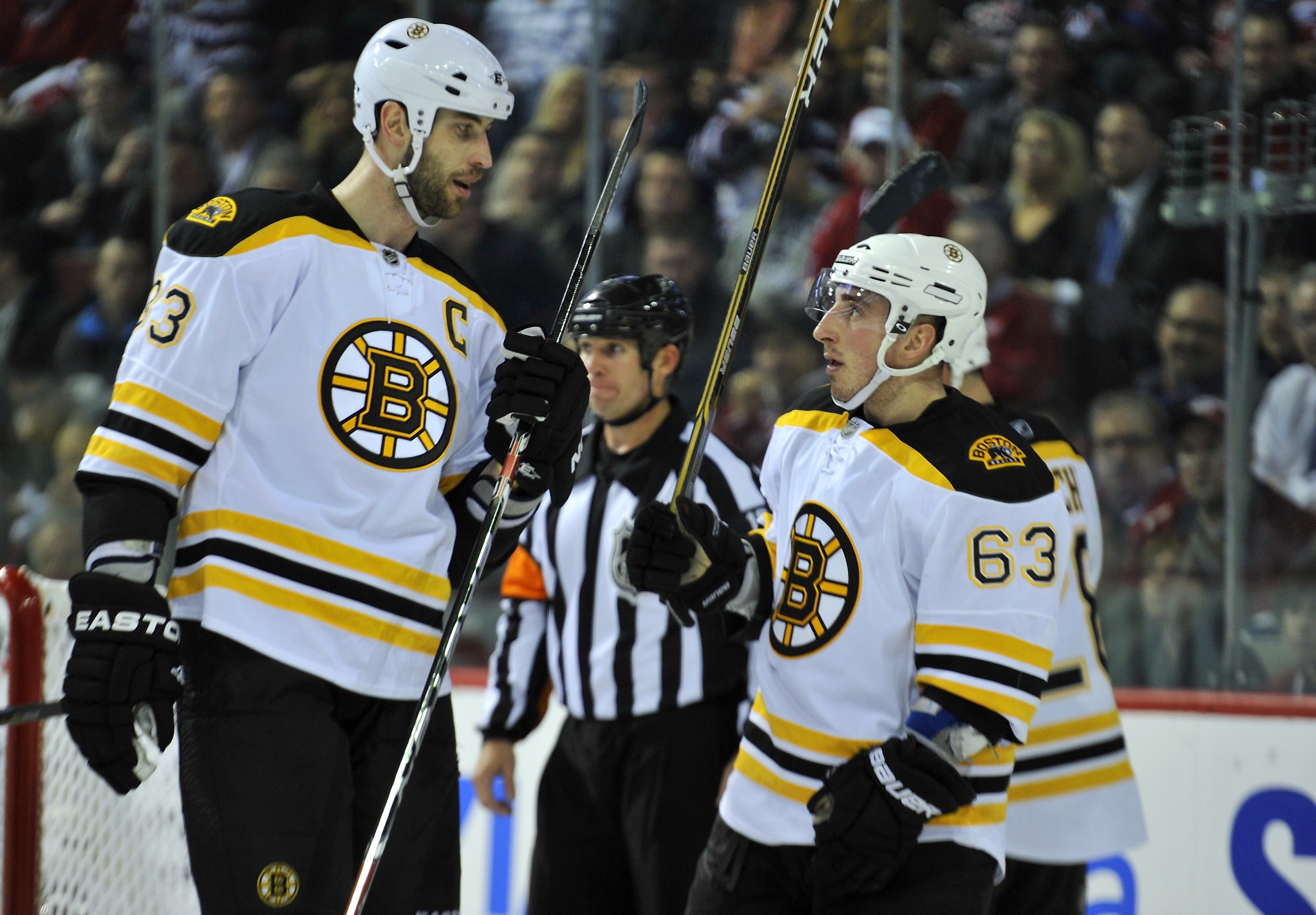 MONTREAL, CANADA - APRIL 18:  Zdeno Chara #33 of the Boston Bruins talks with teammate Brad Marchand #63 before a faceoff in Game Three of the Eastern Conference Quarterfinals against the Montreal Canadiens during the 2011 NHL Stanley Cup Playoffs at the