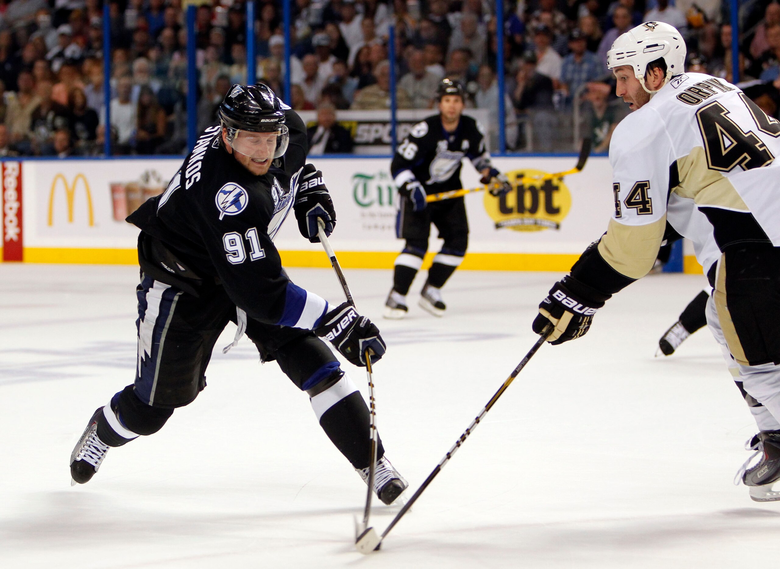 TAMPA, FL - APRIL 20: Steven Stamkos #91 of the Tampa Bay Lightning shoots the puck against Brooks Orpik #44 of the Pittsburgh Penguins in Game Four of the Eastern Conference Quarterfinals during the 2011 NHL Stanley Cup Playoffs at the St. Pete Times For