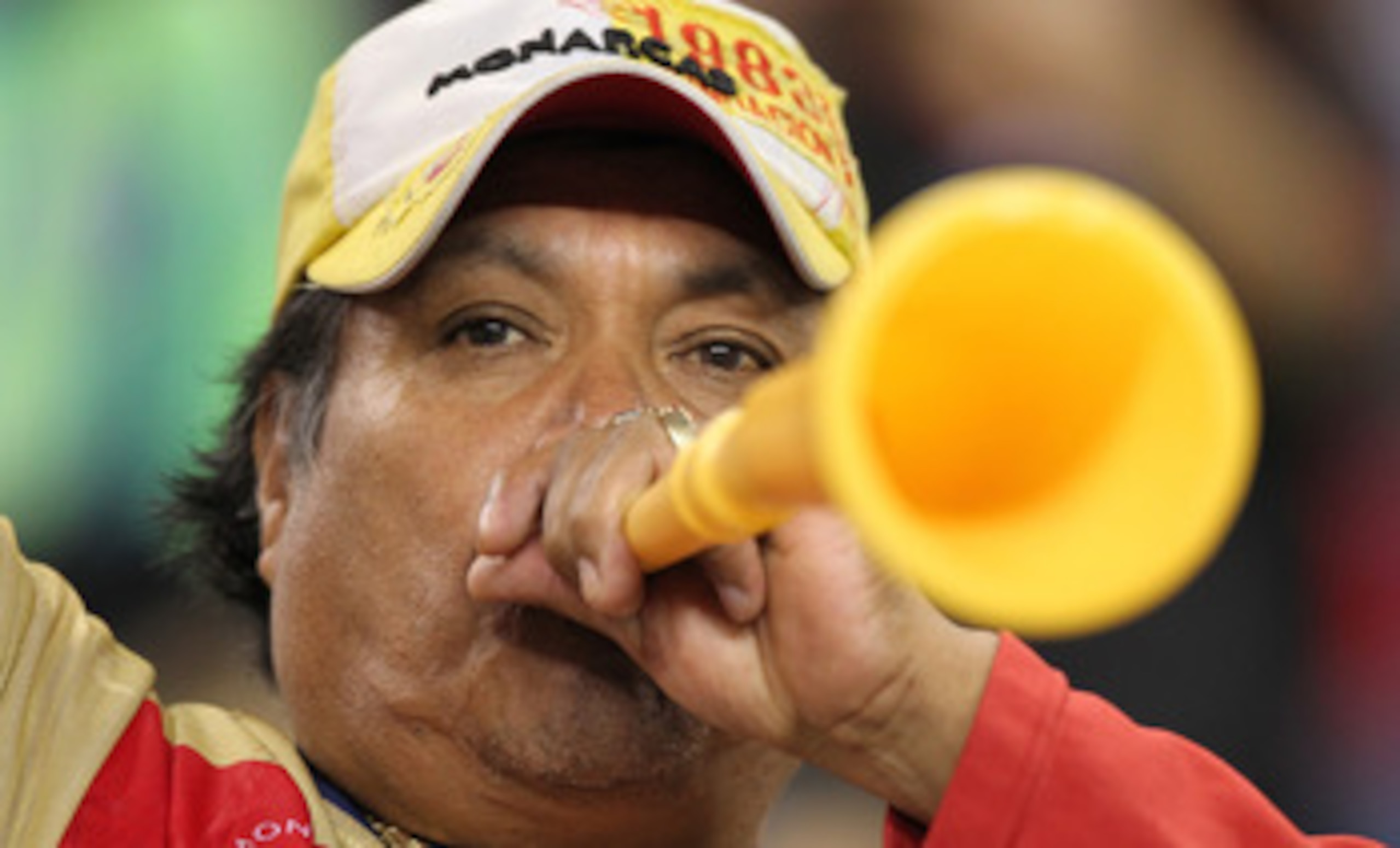 SEATTLE - OCTOBER 12:  A fan of Chivas de Guadalajara blows a vuvuzela during the game against the Seattle Sounders FC on October 12, 2010 at Qwest Field in Seattle, Washington. The Sounders defeated Chivas de Guadalajara 3-1. (Photo by Otto Greule Jr/Get