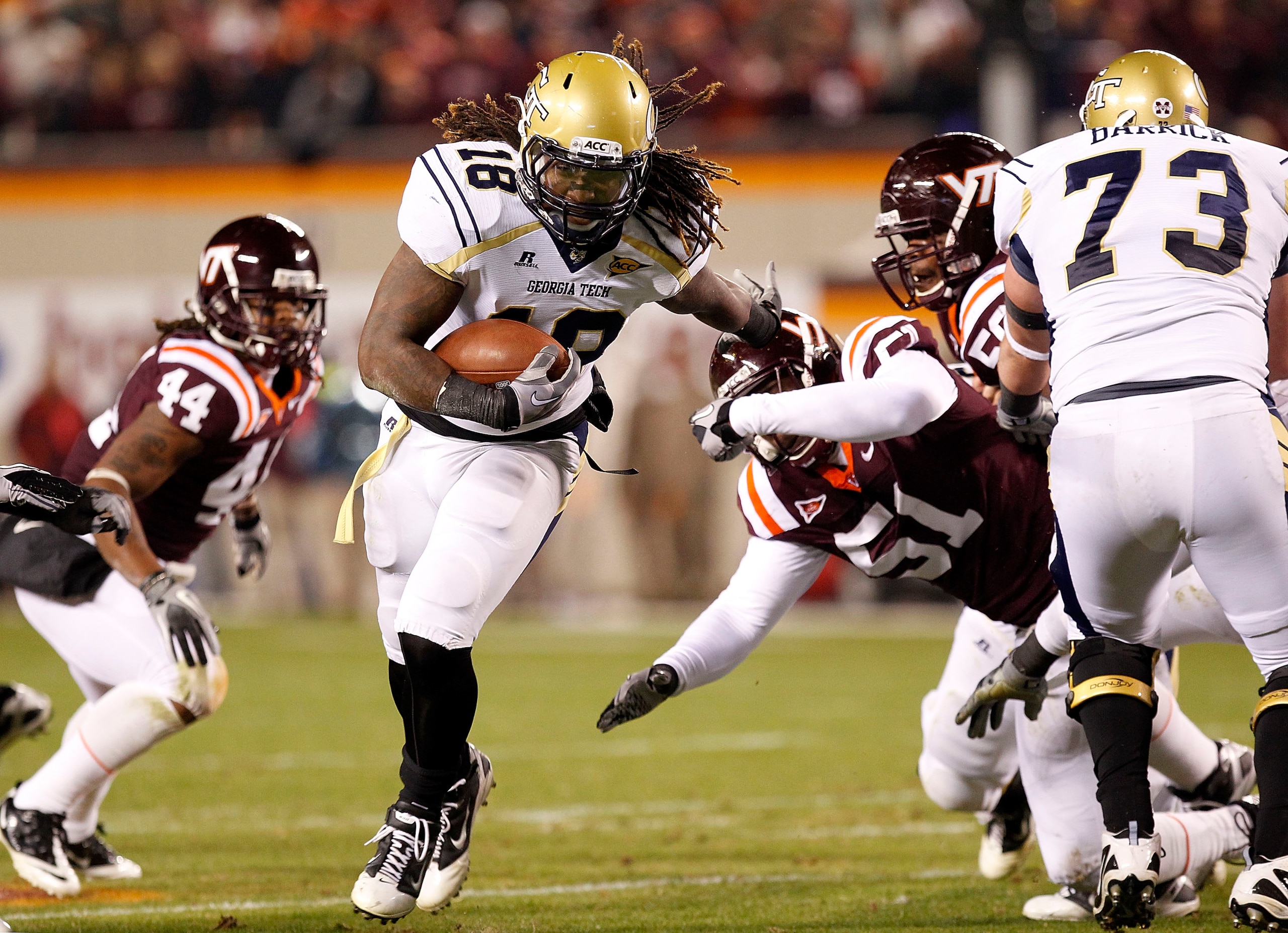 BLACKSBURG, VA - NOVEMBER 04: Running back Anthony Allen #18 of the Georgia Tech Yellow Jackets runs with the ball as linebacker Bruce Taylor #51 of the Virginia Tech Hokies chases at Lane Stadium on November 4, 2010 in Blacksburg, Virginia.  (Photo by Ge