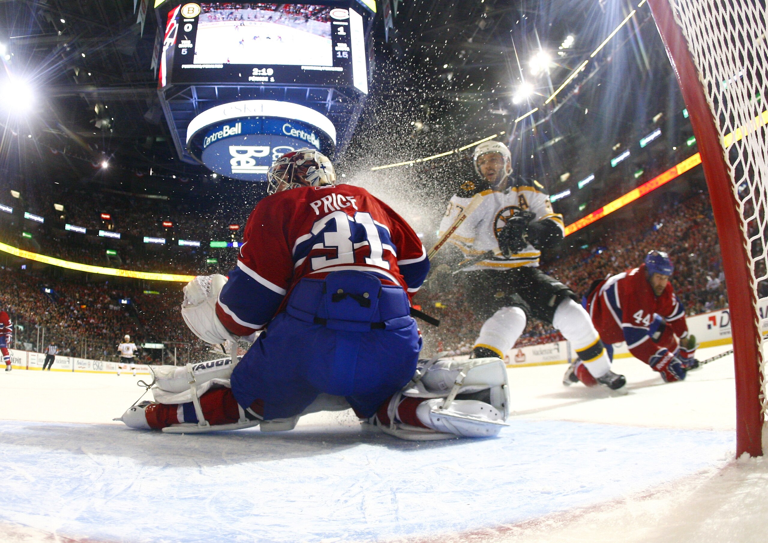 MONTREAL, QC - APRIL 21:  Carey Price #31 of the Montreal Canadies makes a point blank save off a shot by Patrice Bergeron #37 of the Boston Bruins in Game Four of the Eastern Conference Quarterfinals during the 2011 NHL Stanley Cup Playoffs at the Bell C